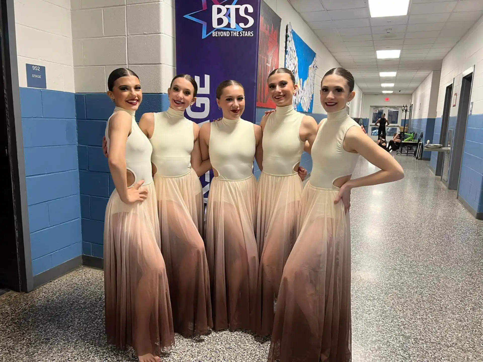a group of women in dresses