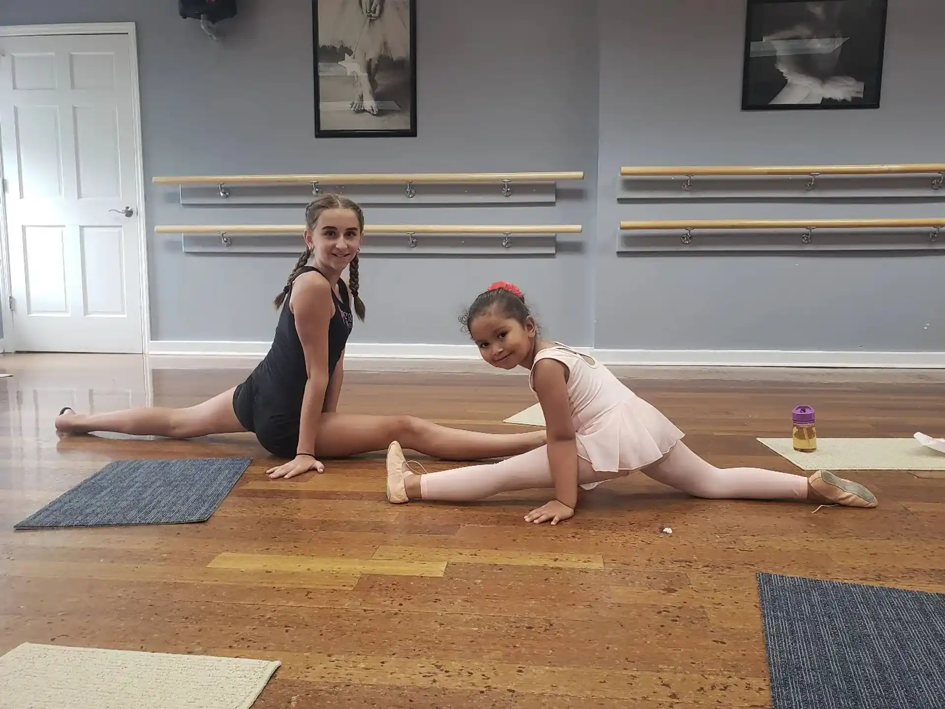 two women doing yoga