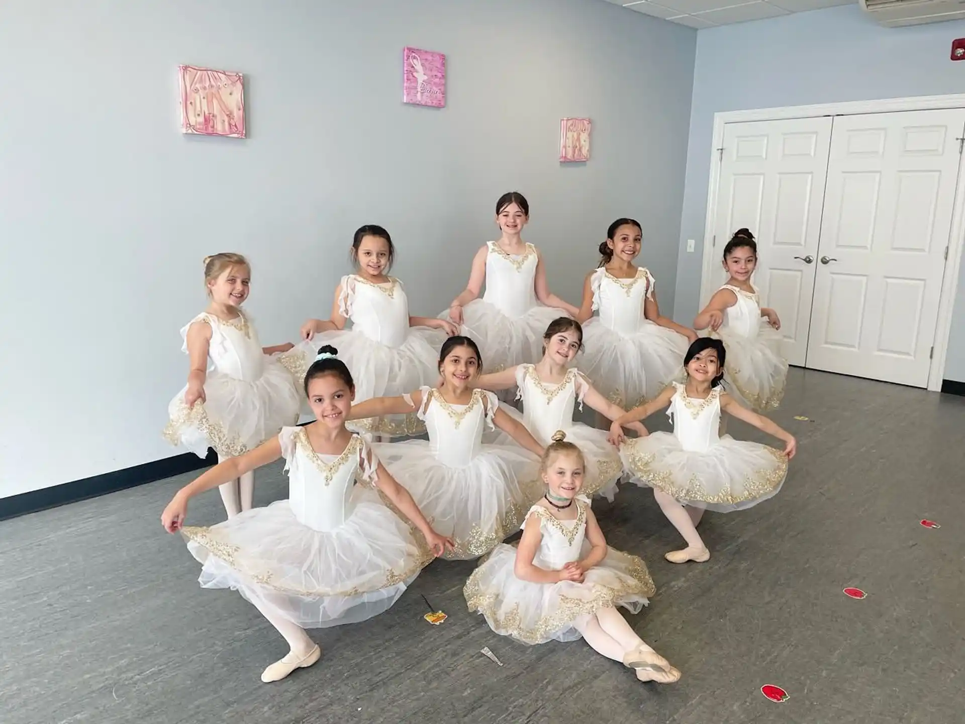 a group of women in white dresses