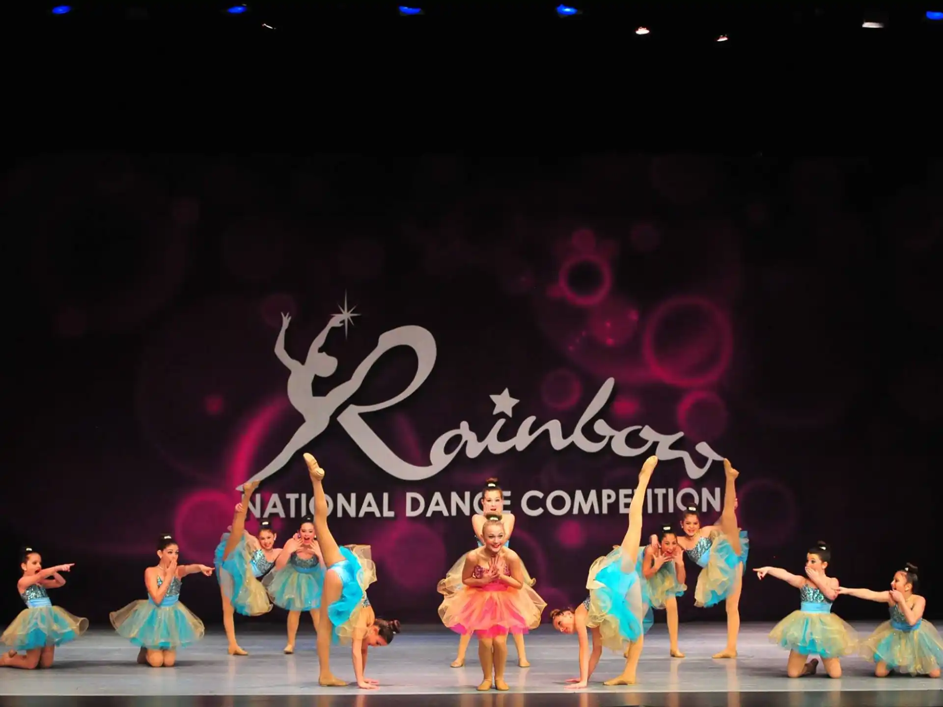 a group of people dancing on a stage