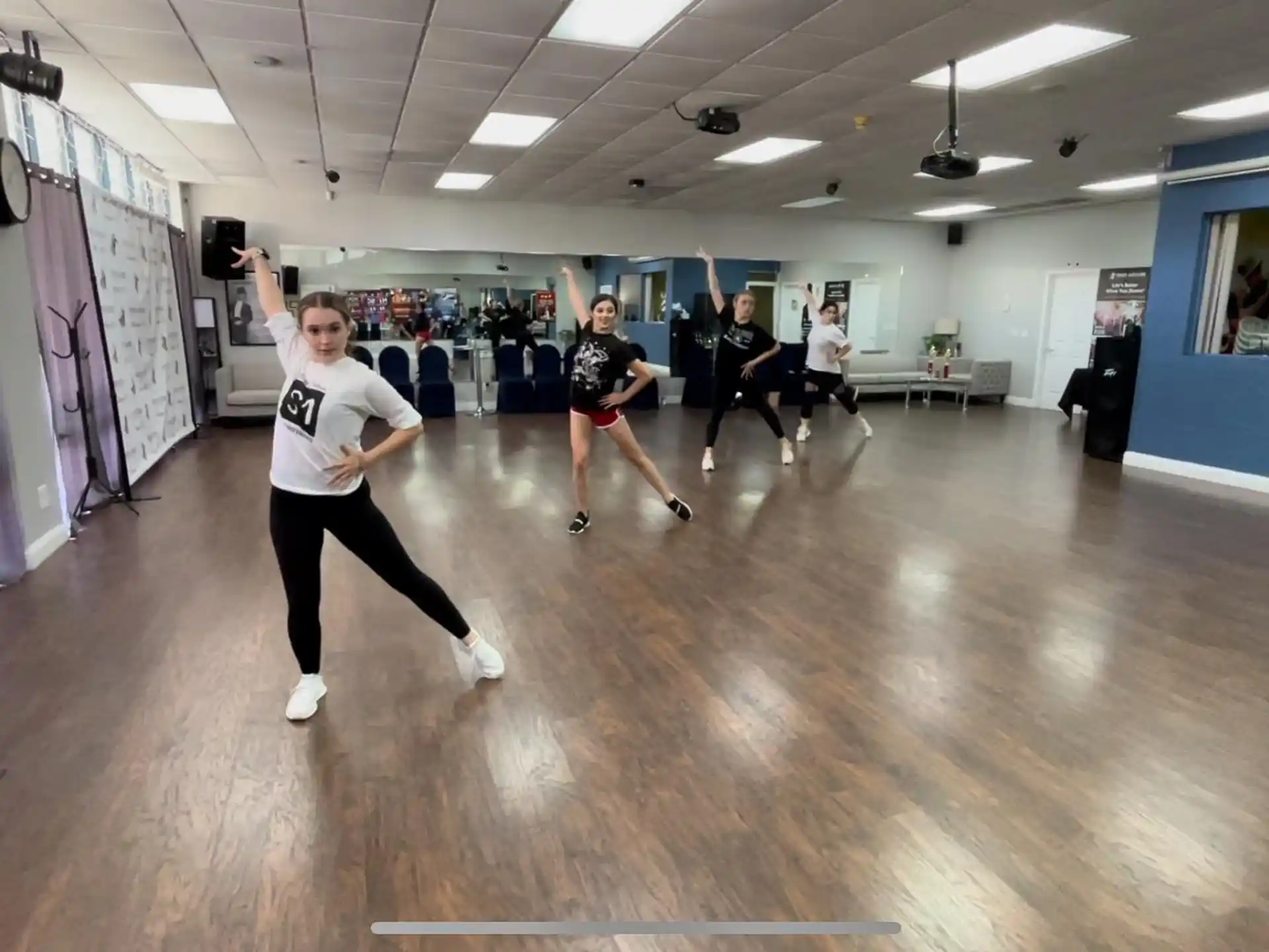 a group of people exercising in a gym