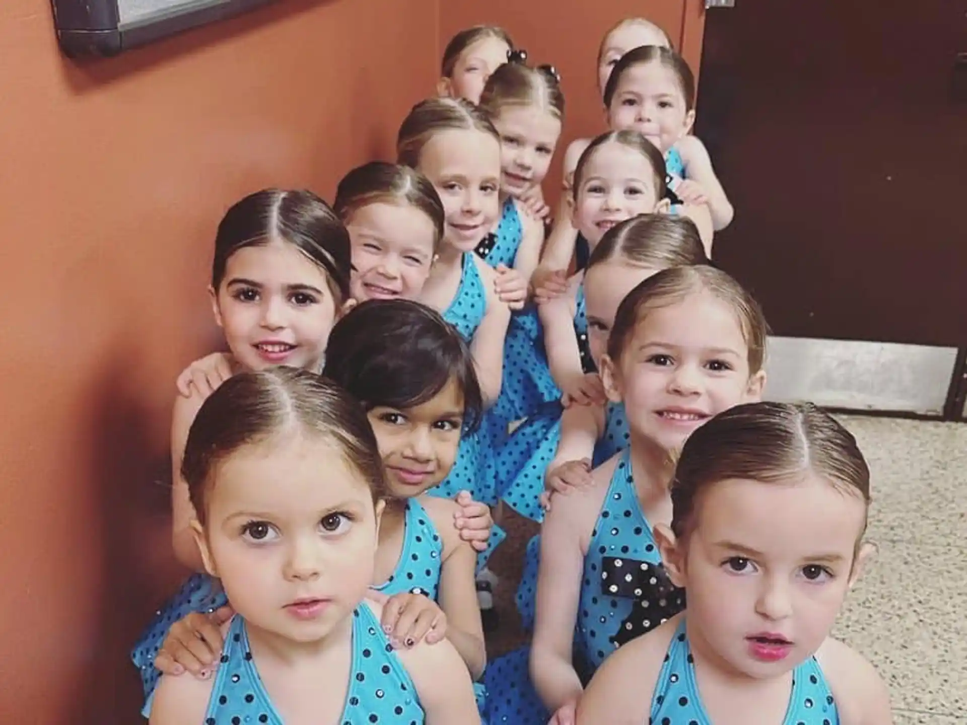 a group of girls posing for a picture