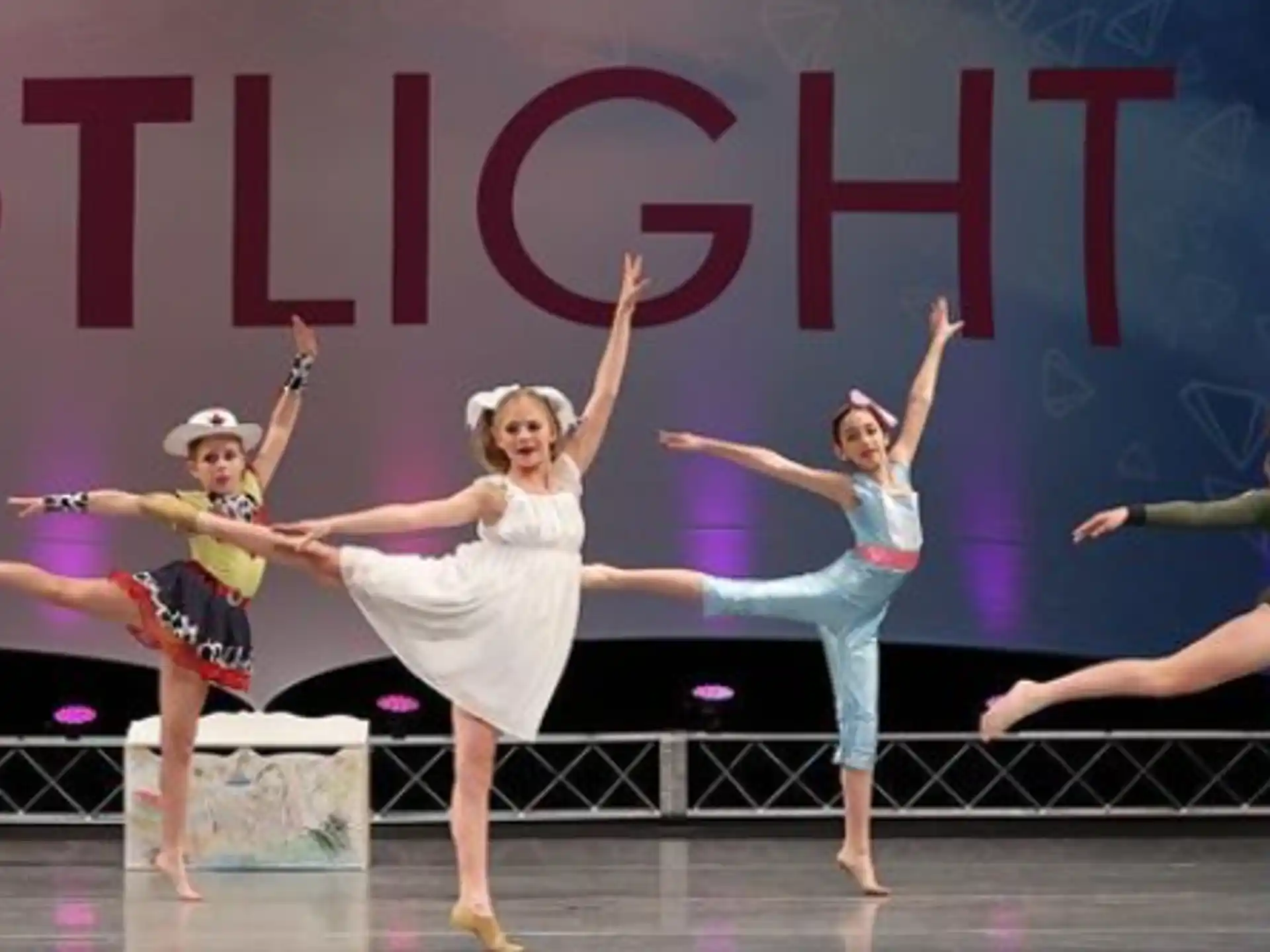 a group of women dancing on a stage