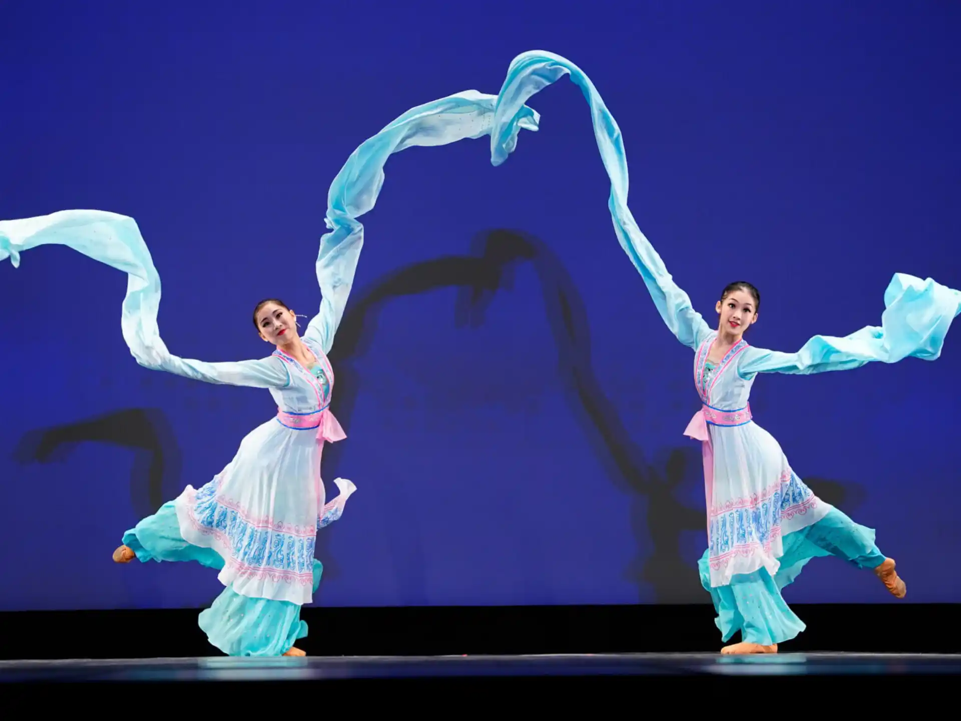 a couple of people dancing on a stage