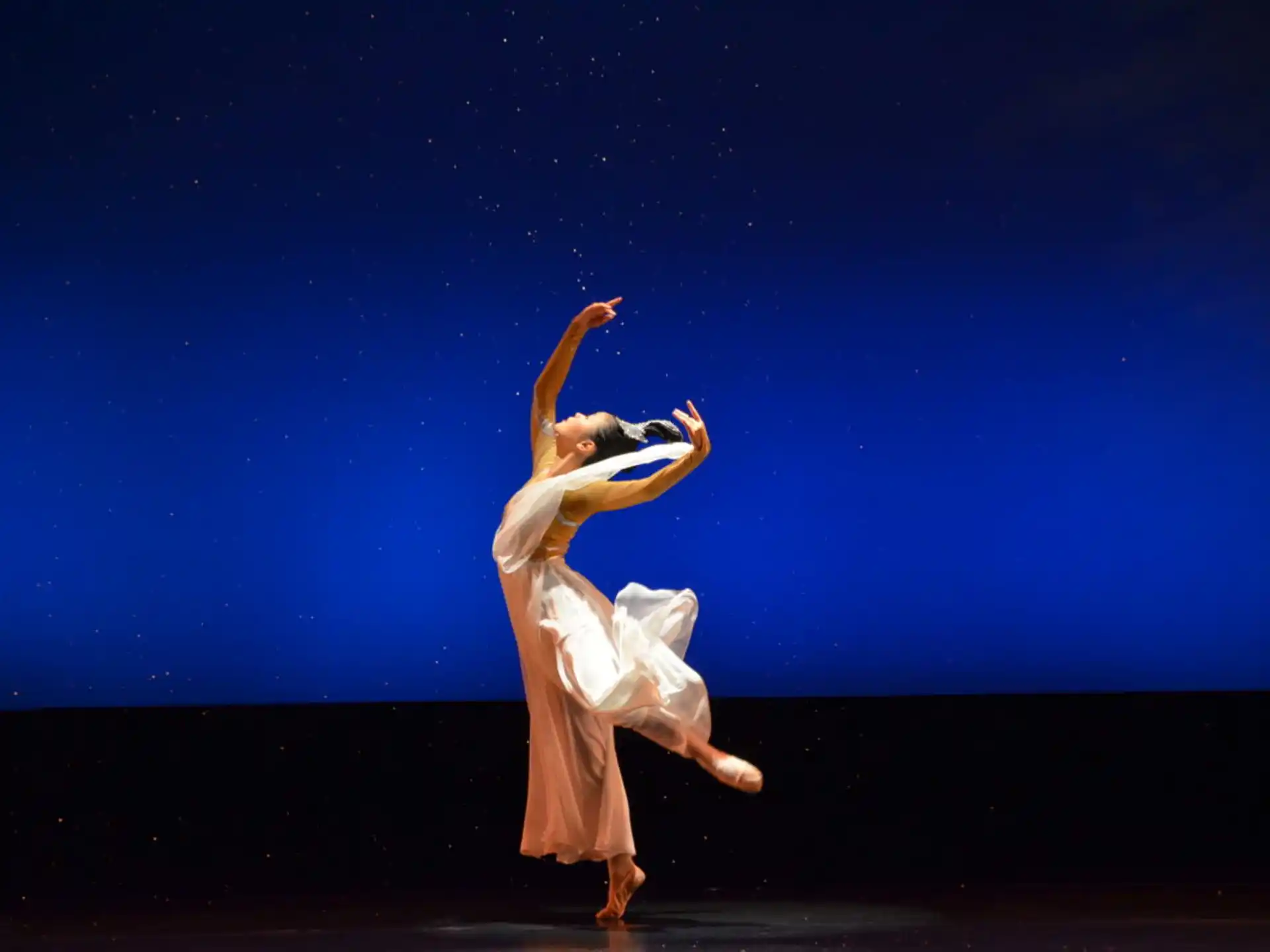 a man dancing on a stage