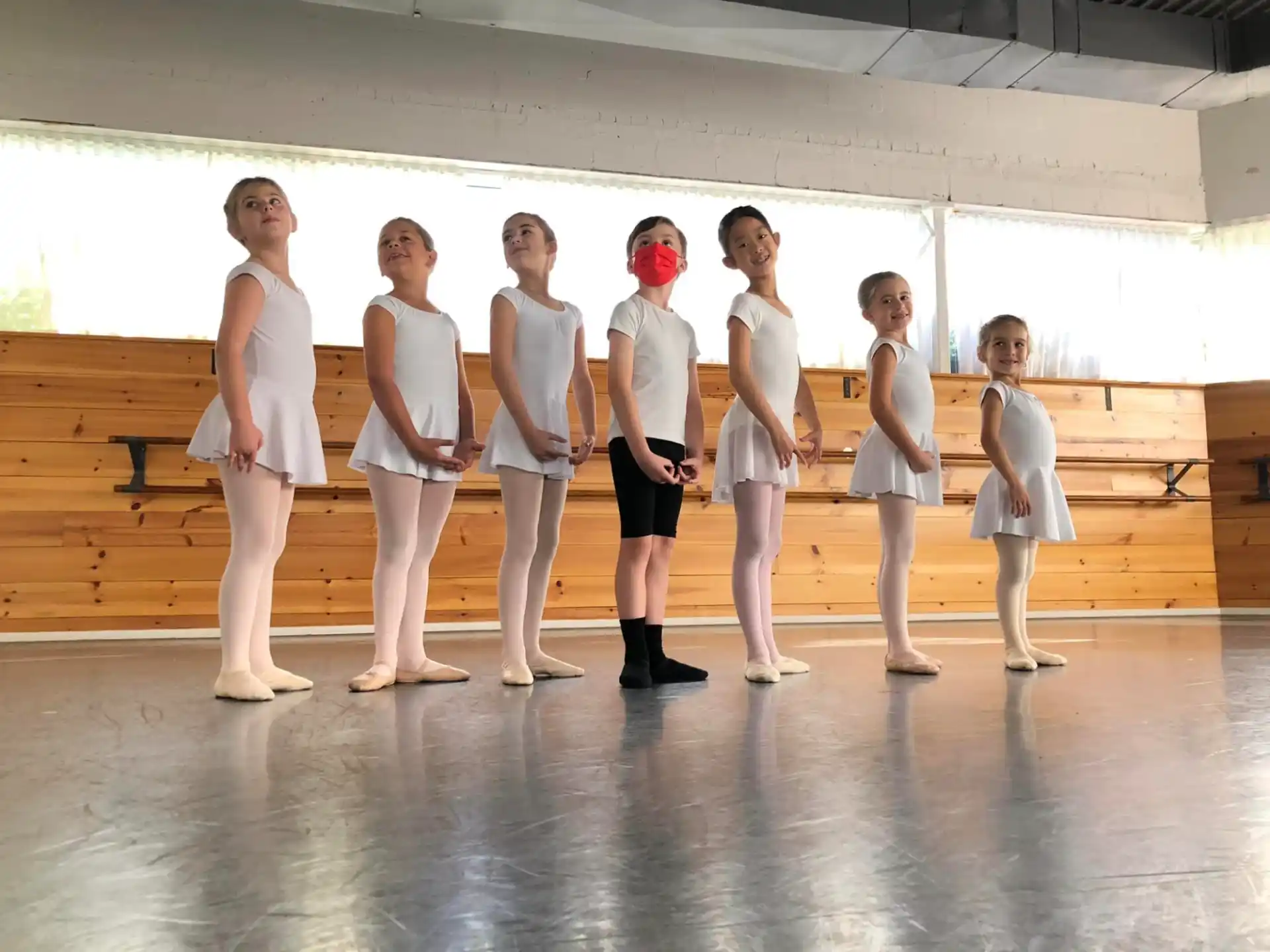 a group of people in white uniforms