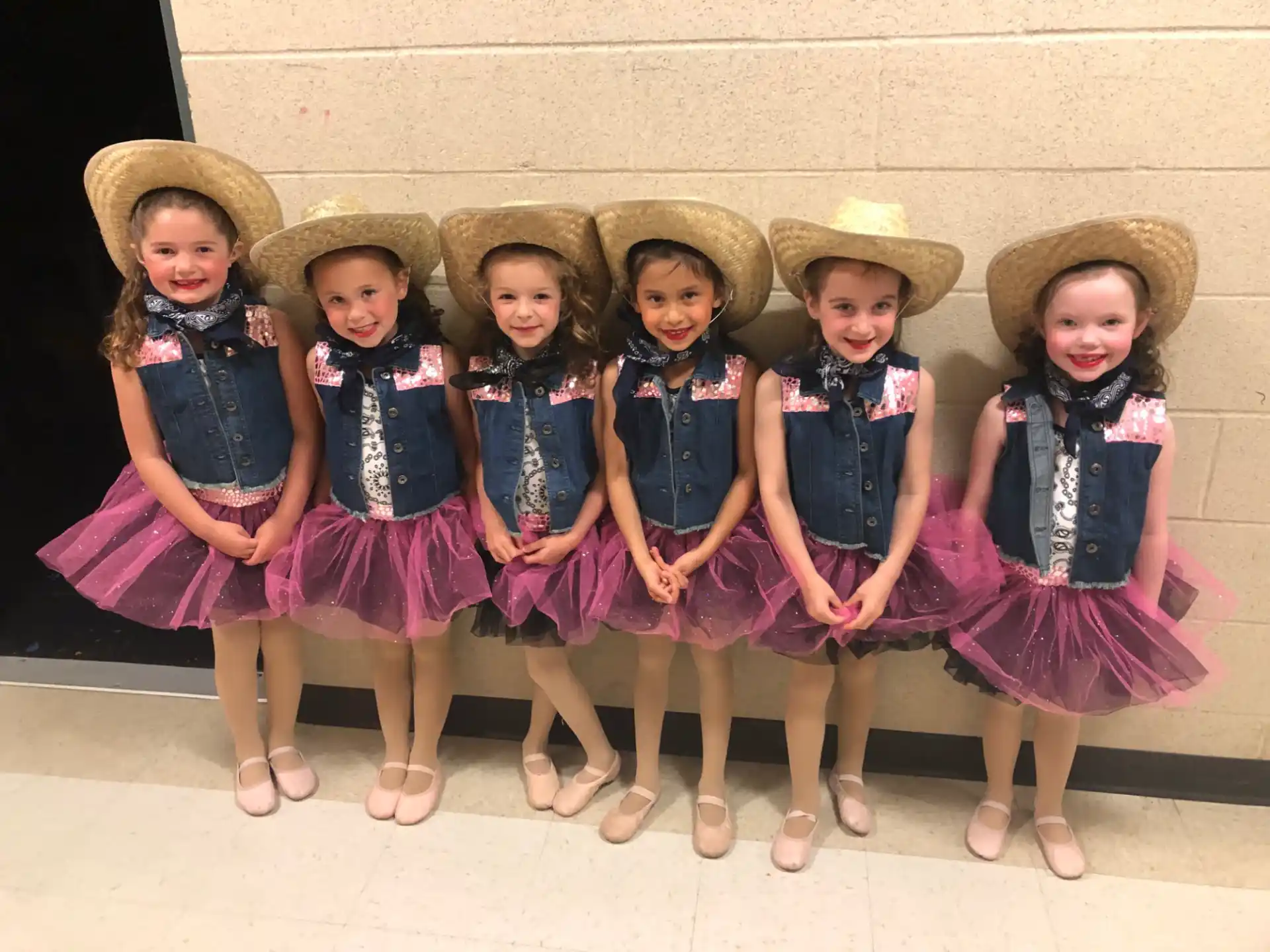 a group of girls wearing hats