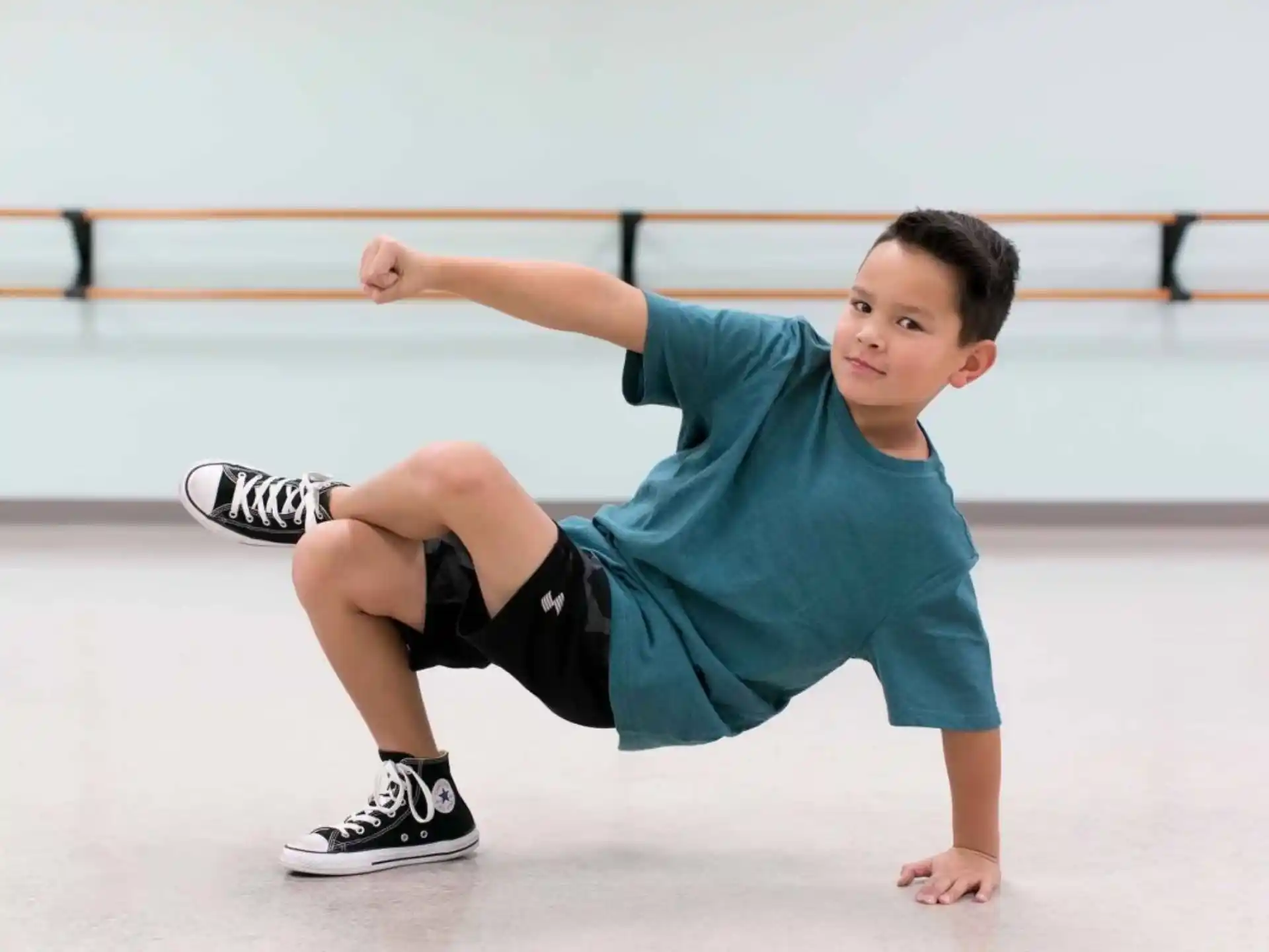 a boy kneeling on ice
