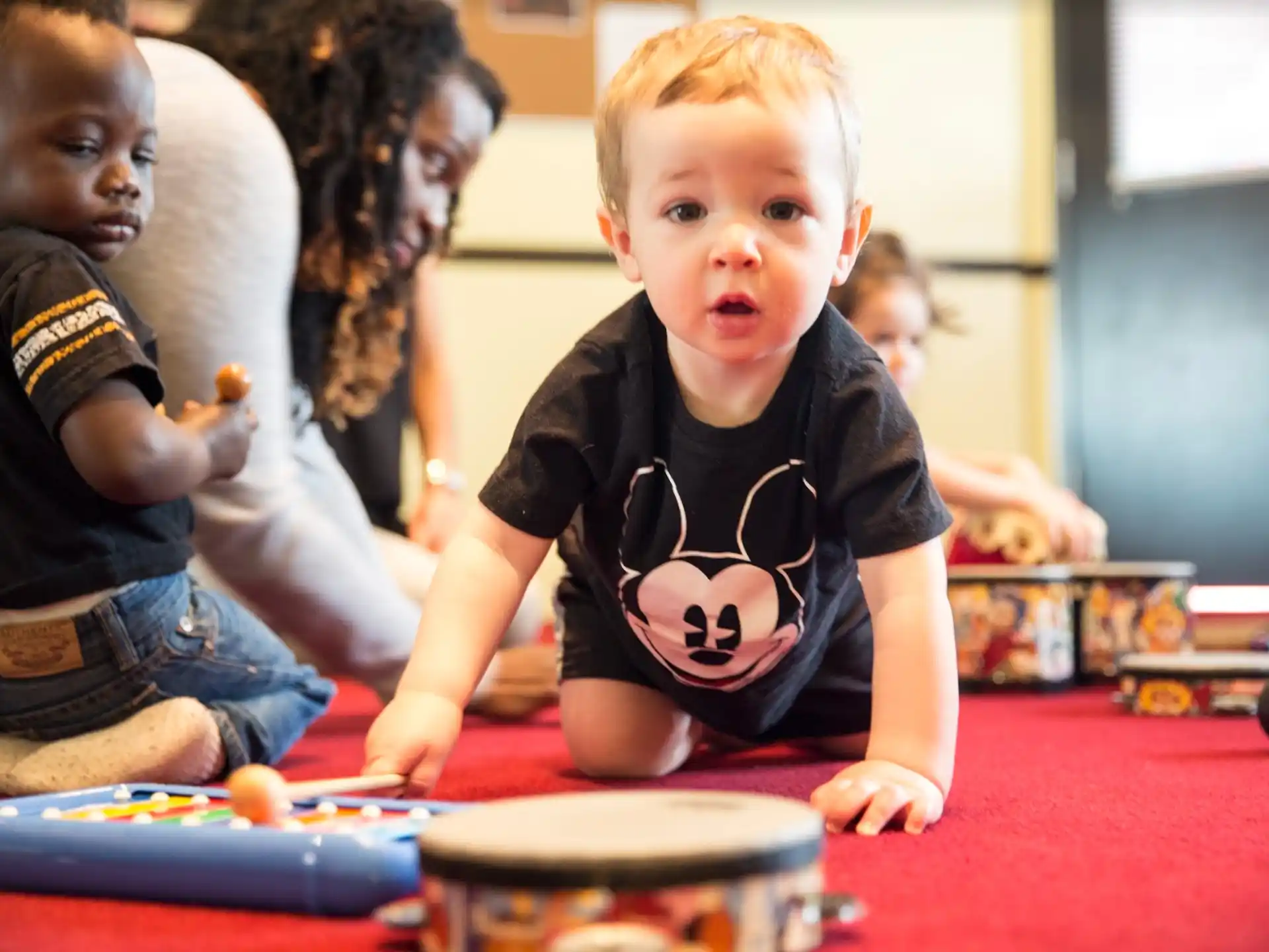 a group of children playing with toys