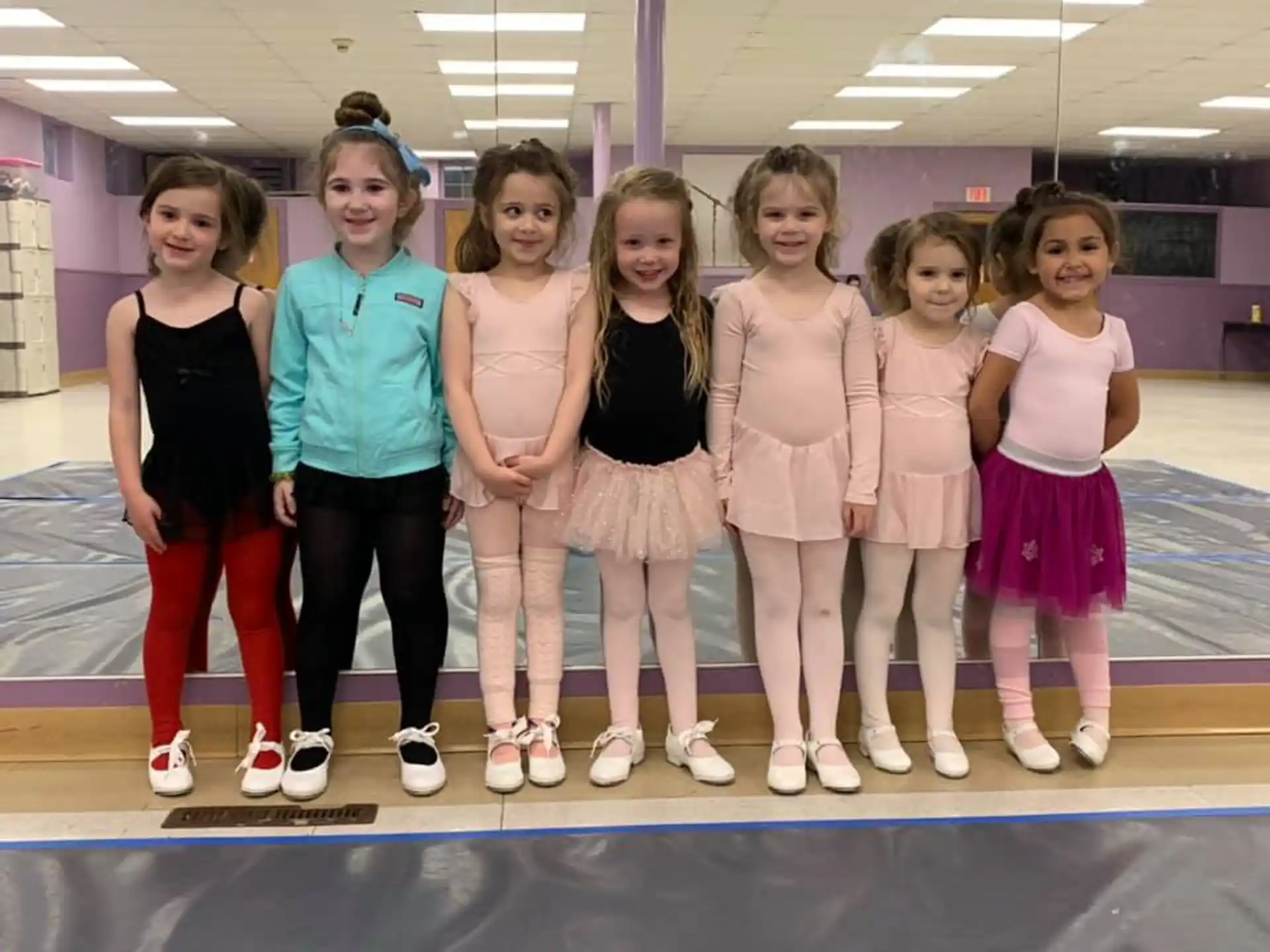 a group of girls posing for a photo