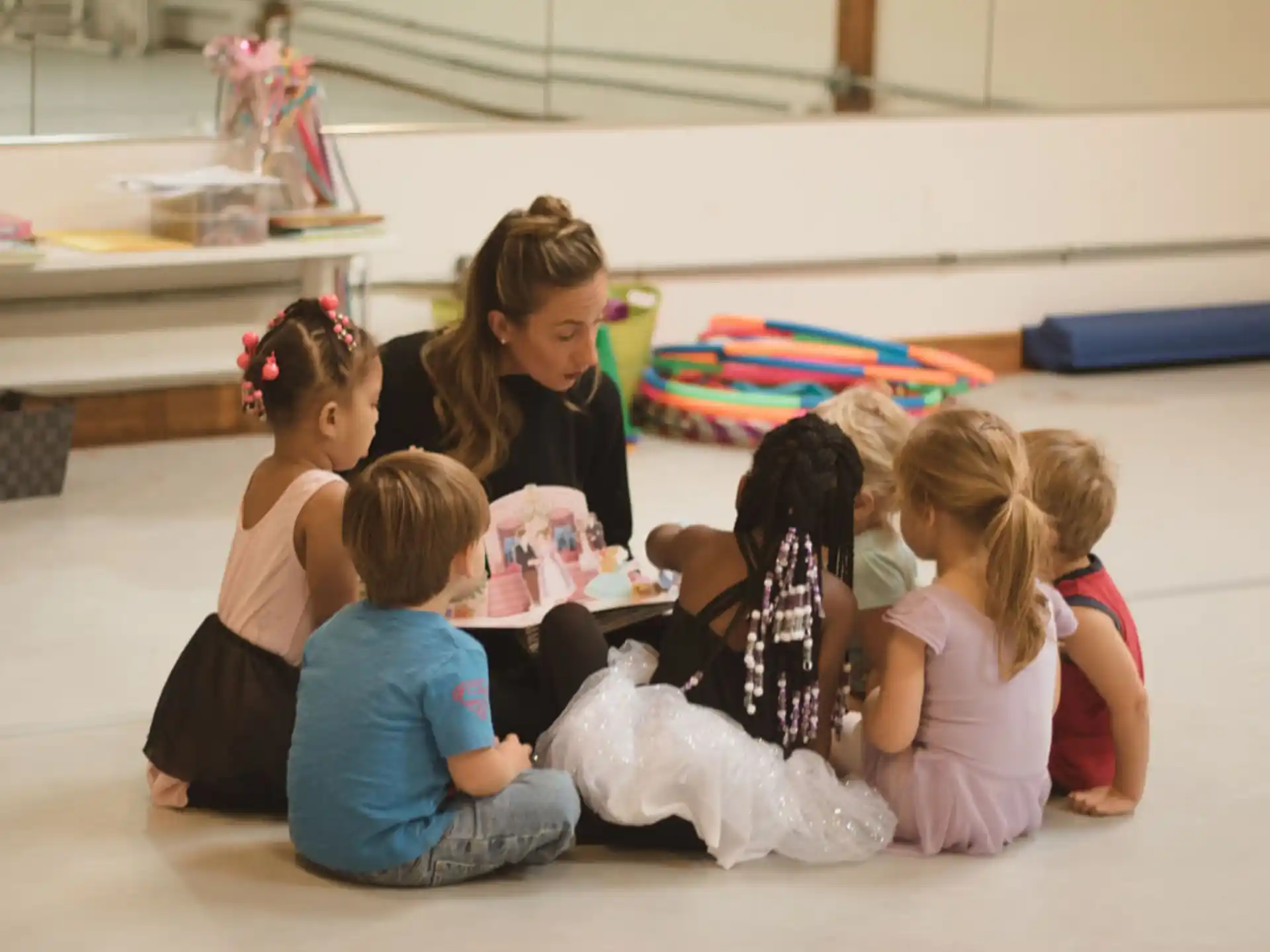 a group of children sitting on the floor