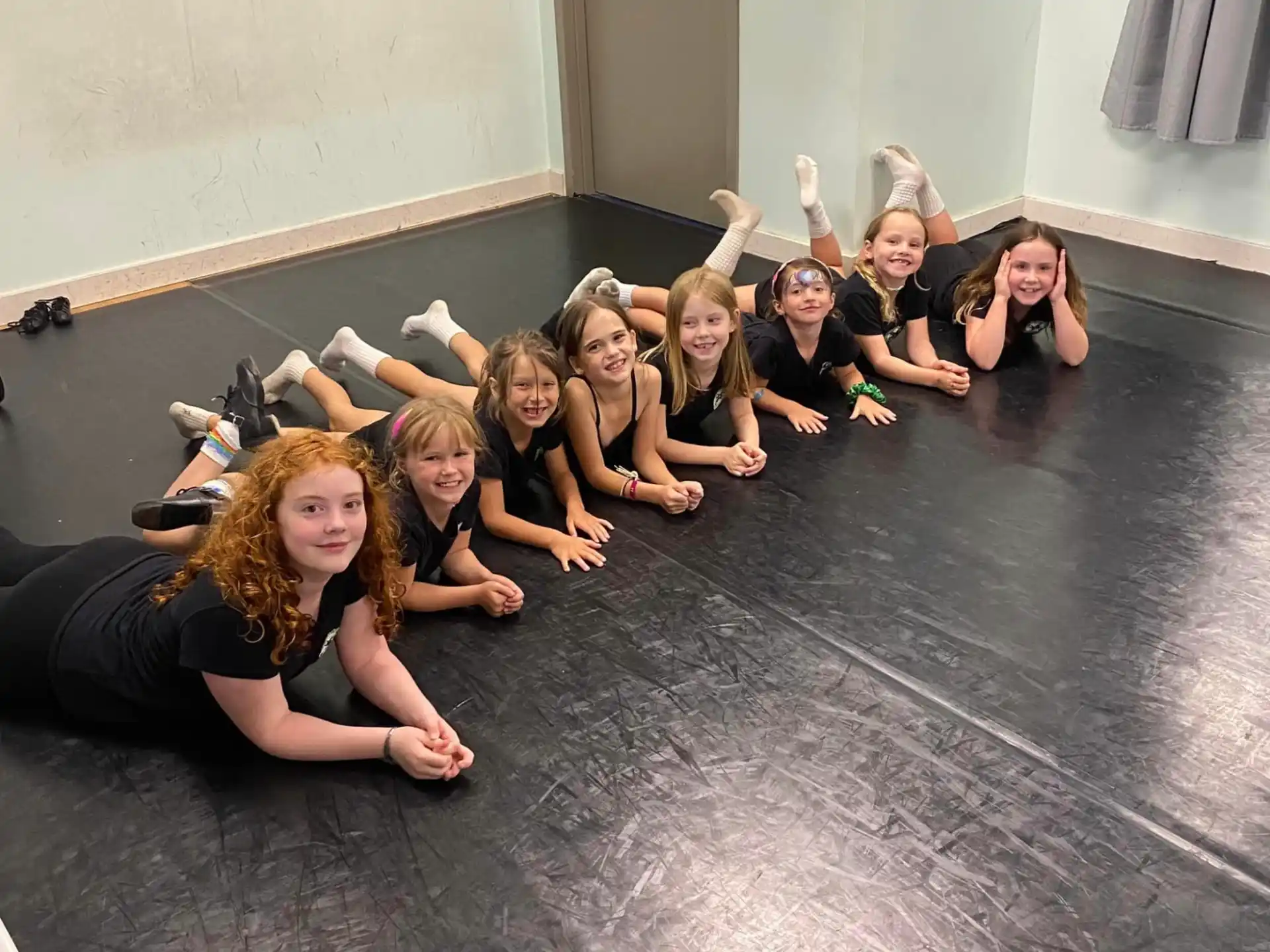 a group of people sitting on a stone floor