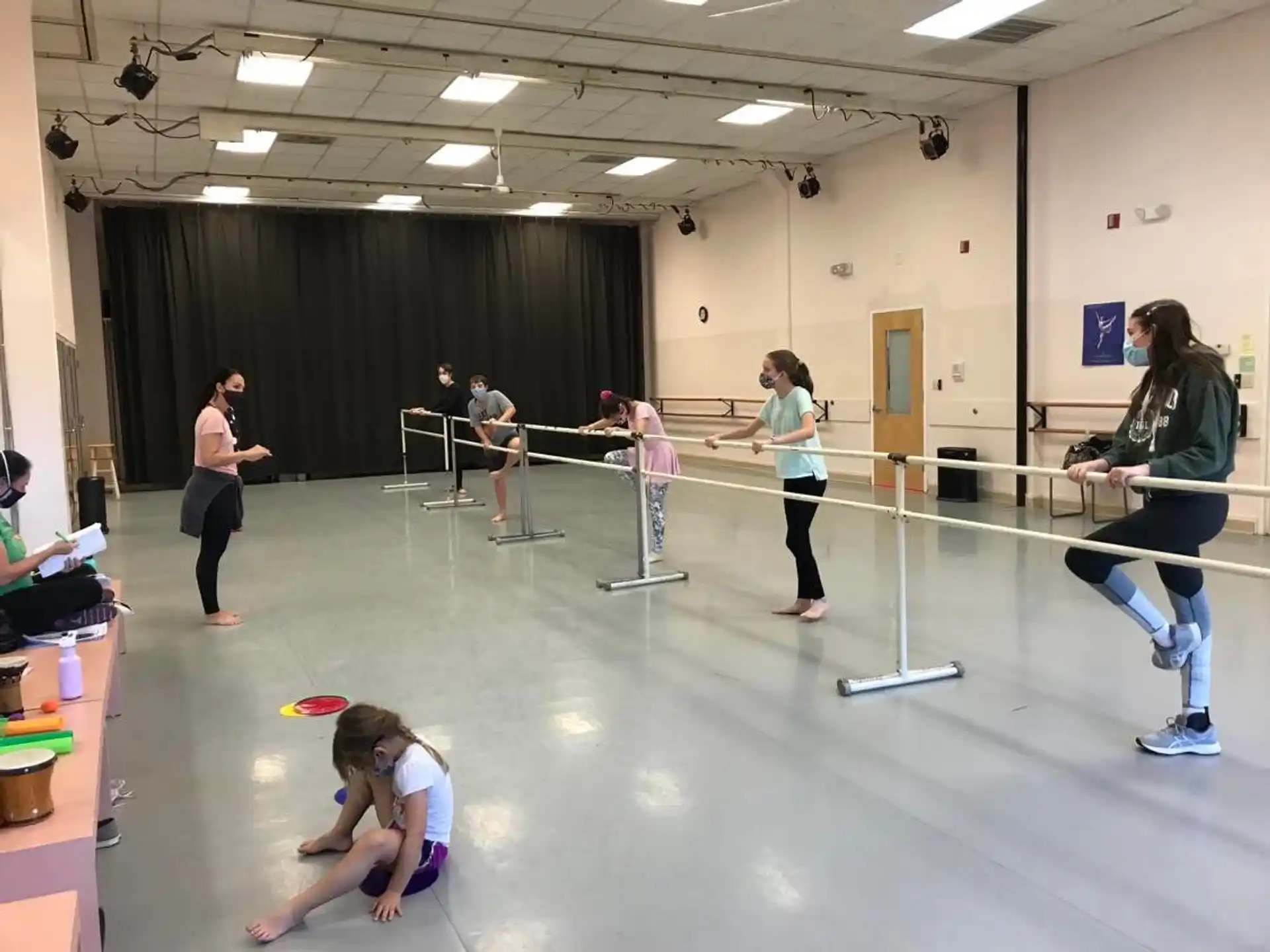 a group of people exercising in a gym