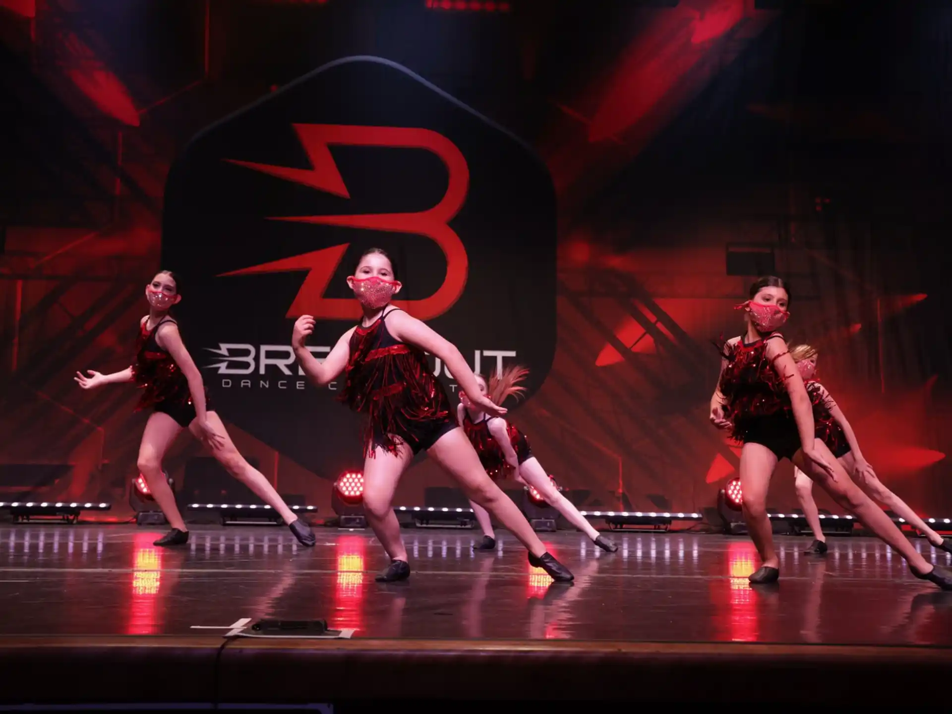 a group of women dancing on a stage