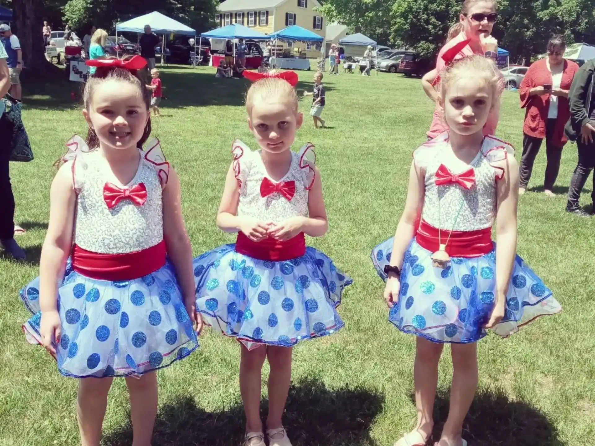 a group of girls in dresses