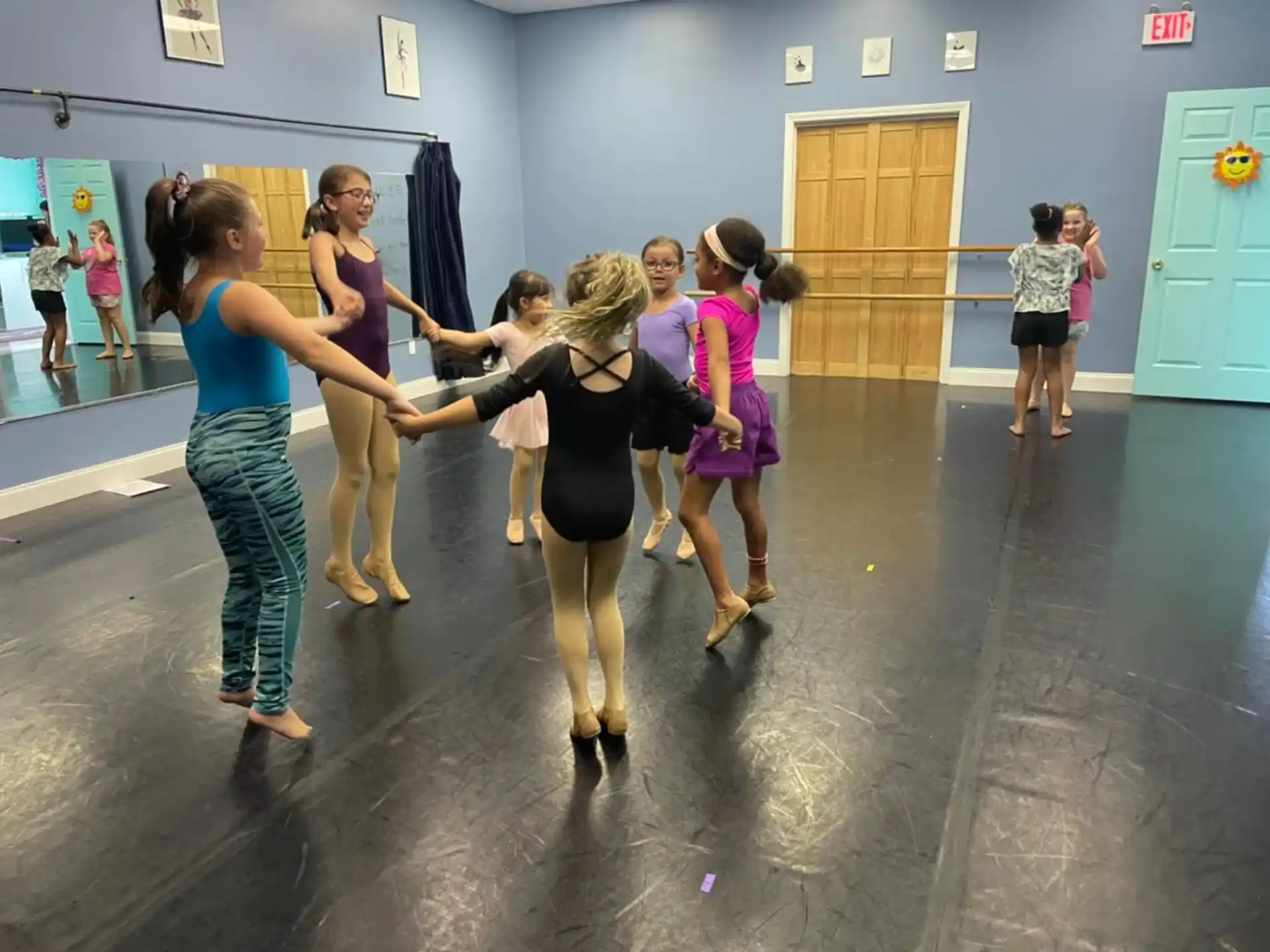 a group of women dancing in a room
