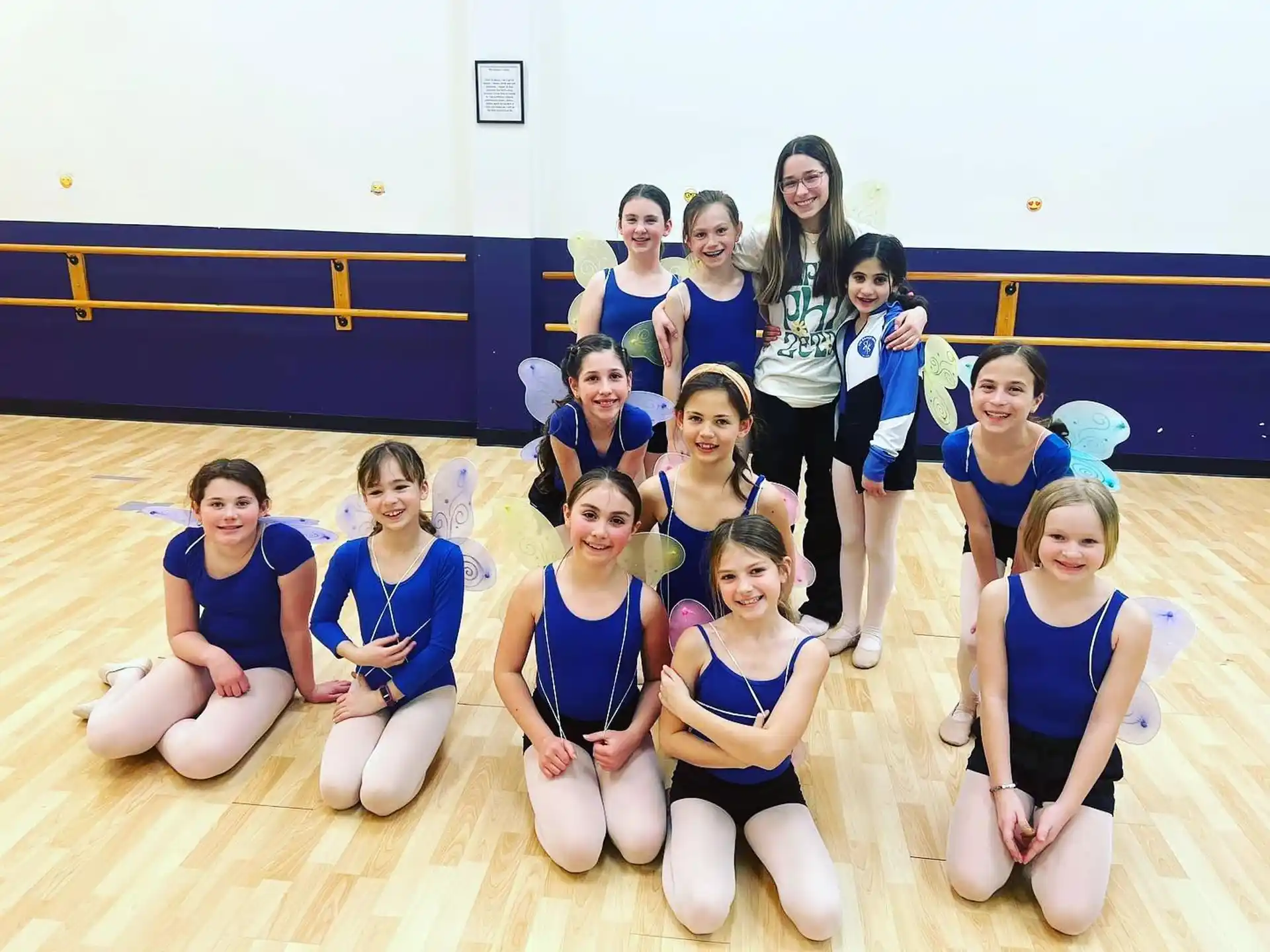a group of girls in blue uniforms