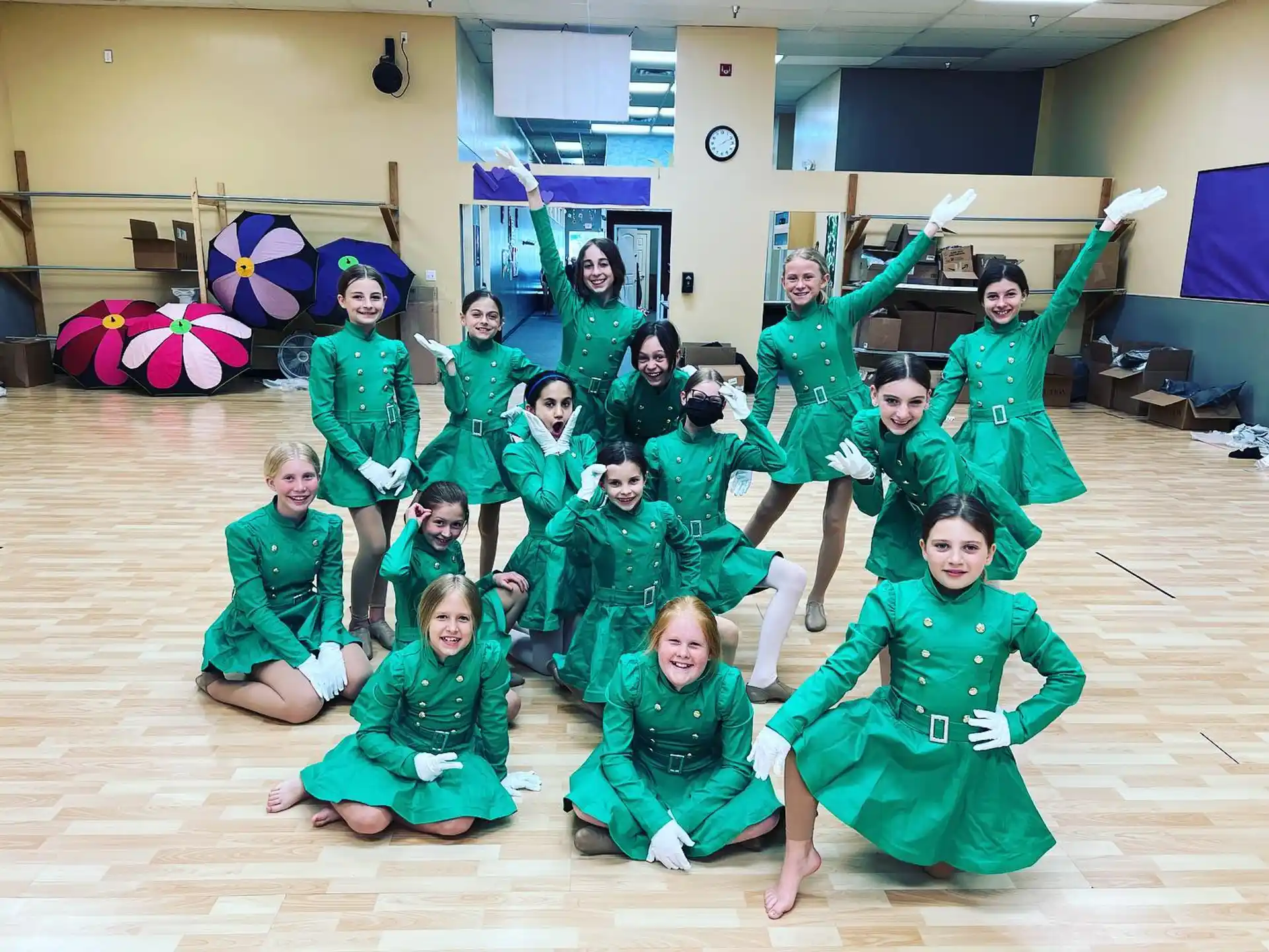 a group of people in green clothing