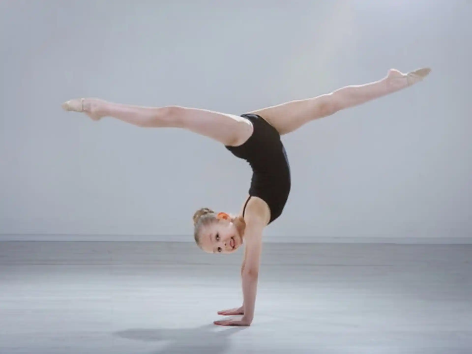 a person doing a handstand