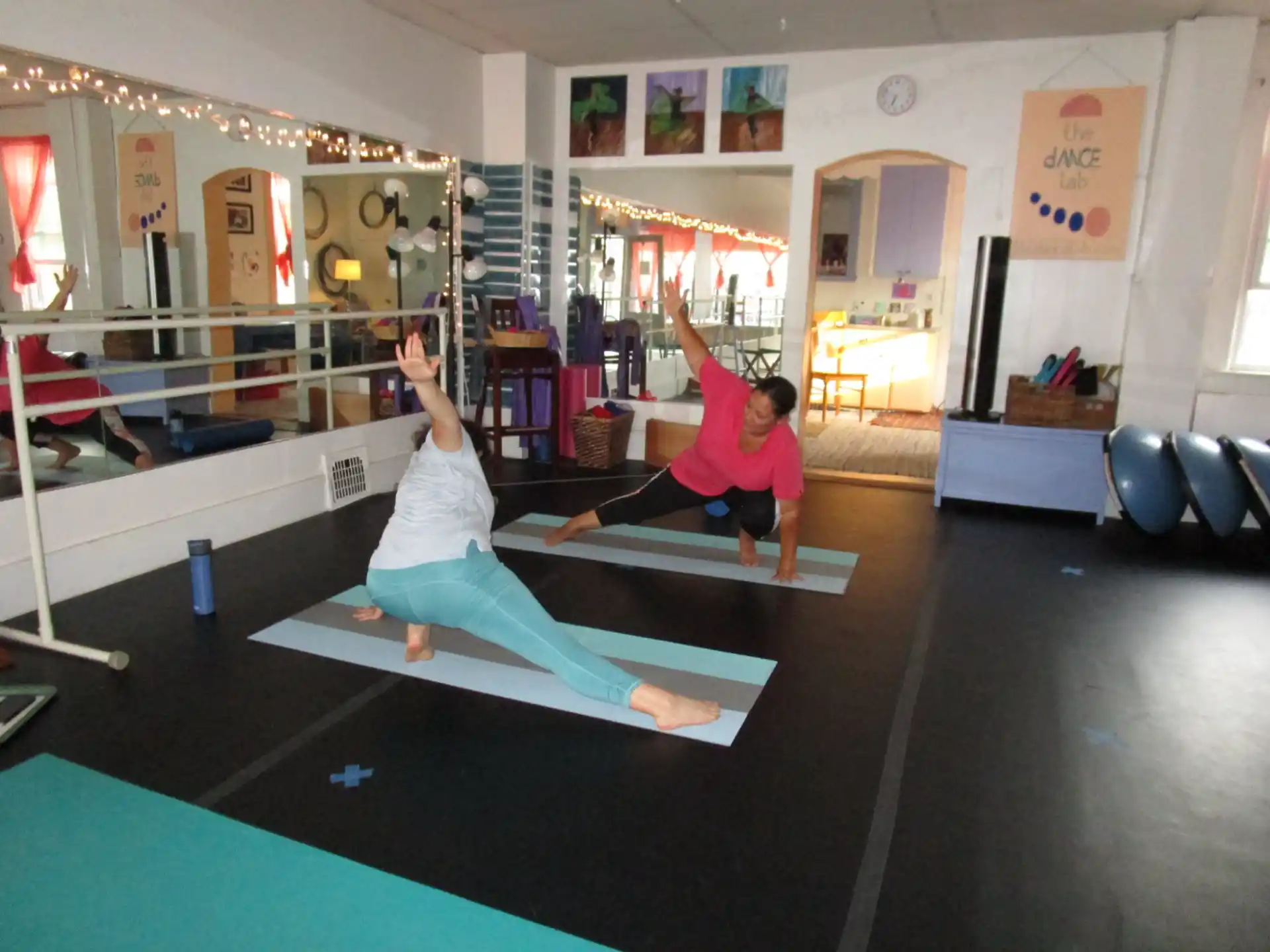 a couple of people doing yoga