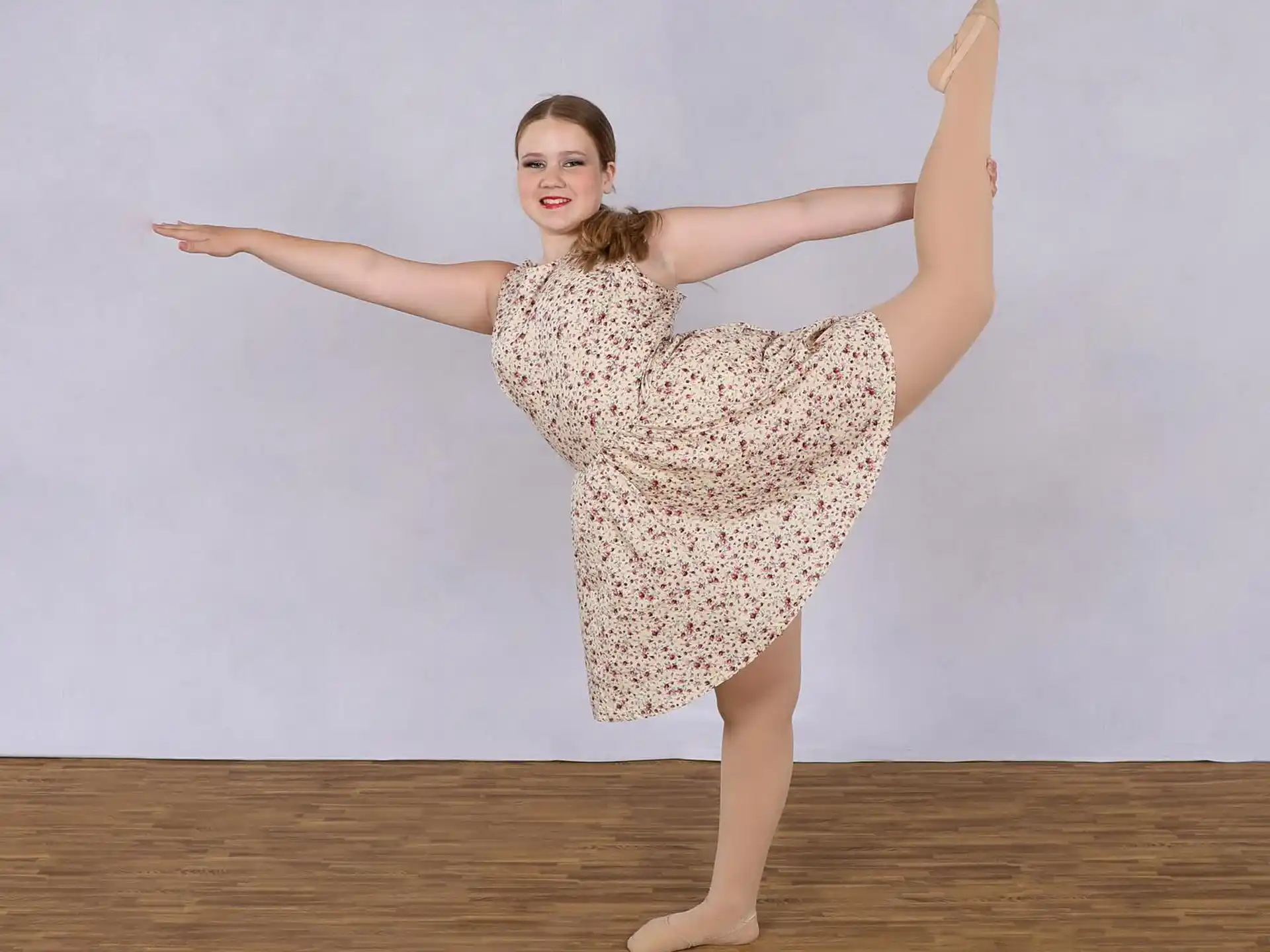 a woman in a dress dancing