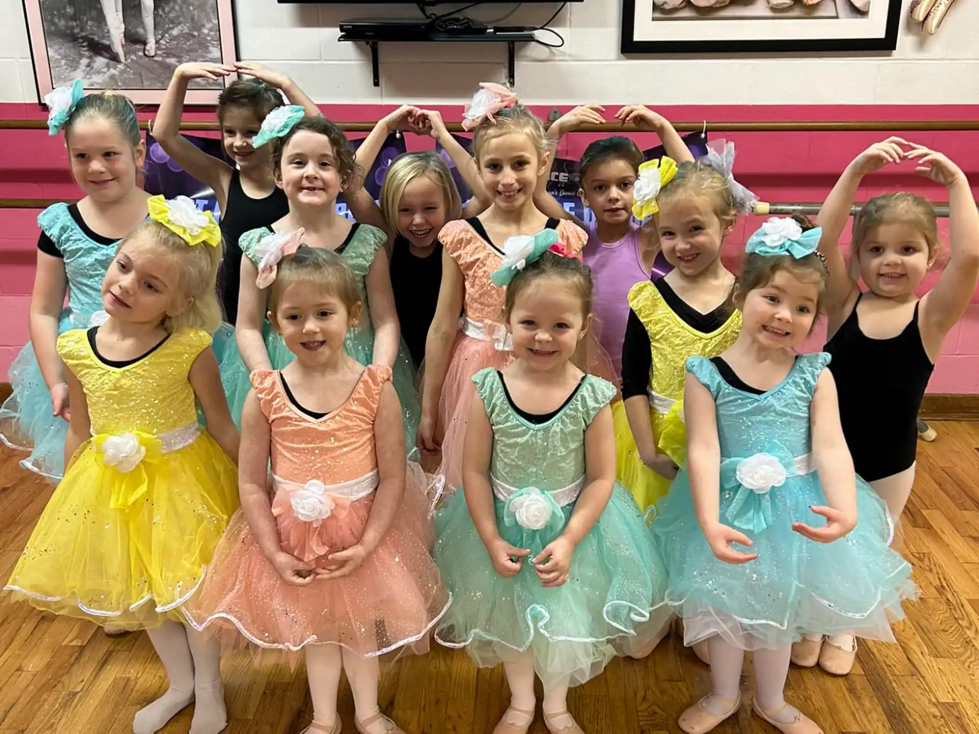 a group of girls in dresses