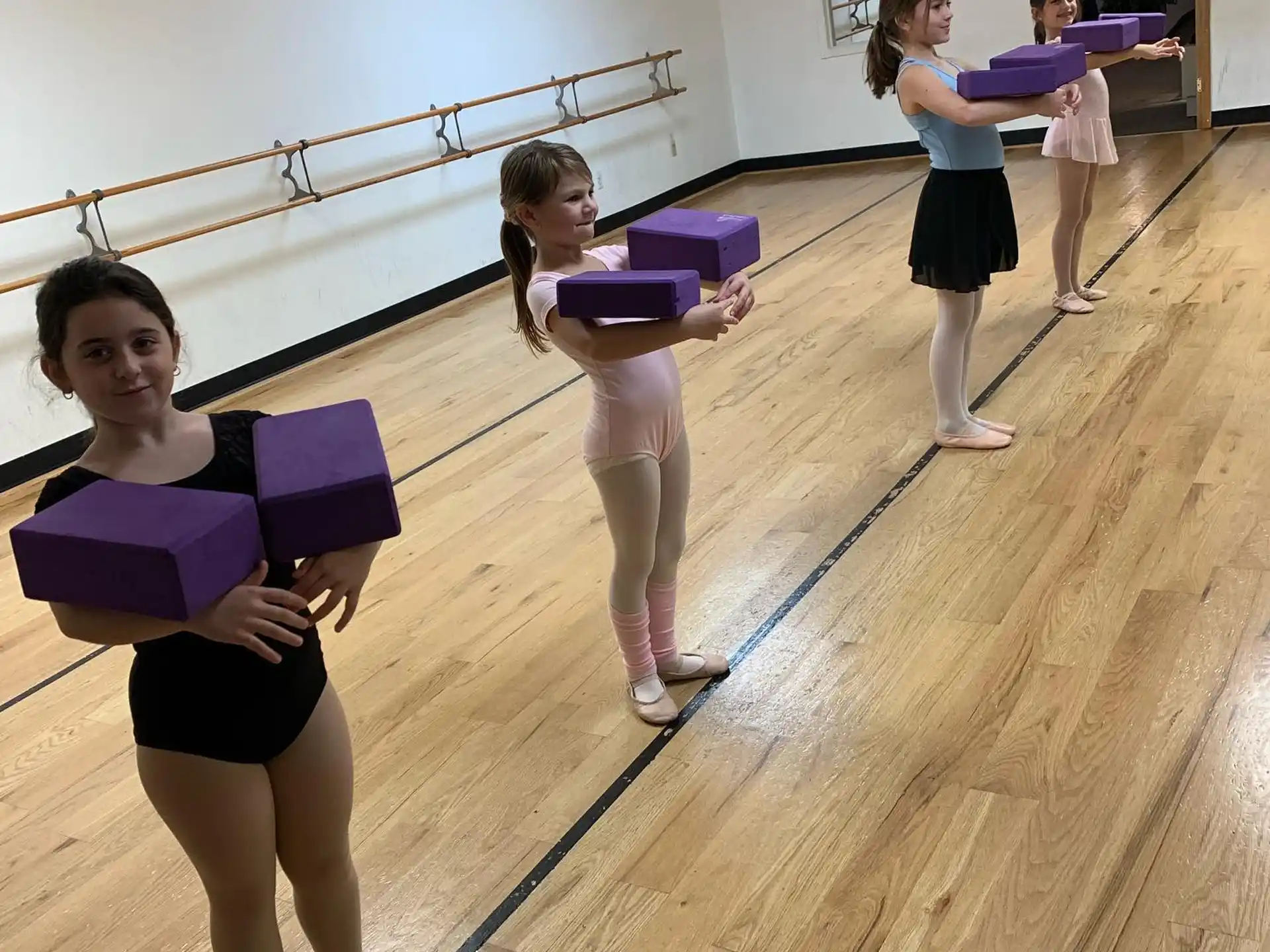 a group of girls holding books