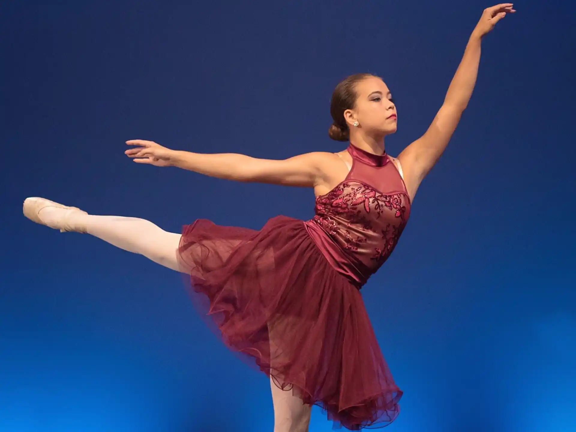 a woman dancing on a stage