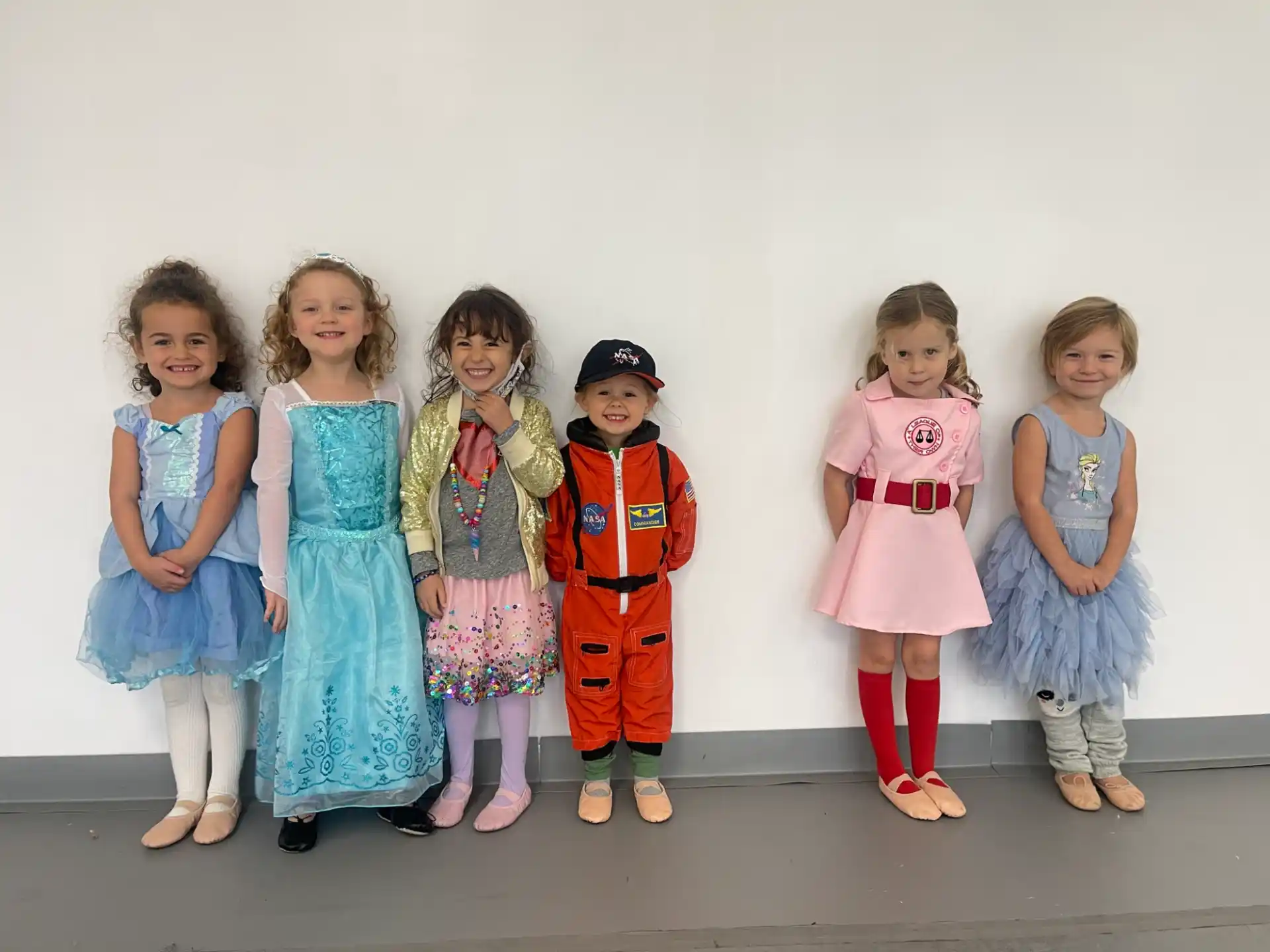 a group of children in clothing