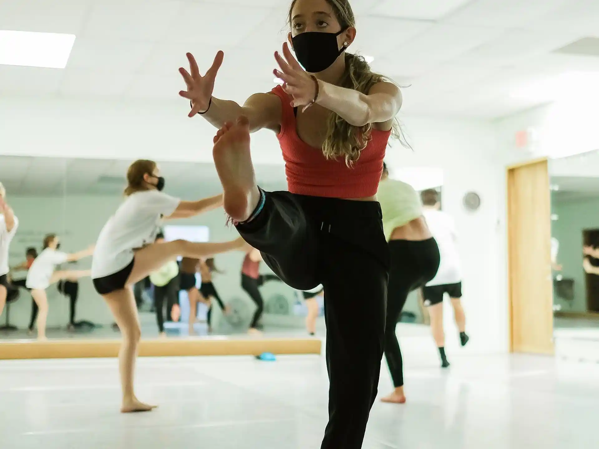 a person holding a camera and dancing