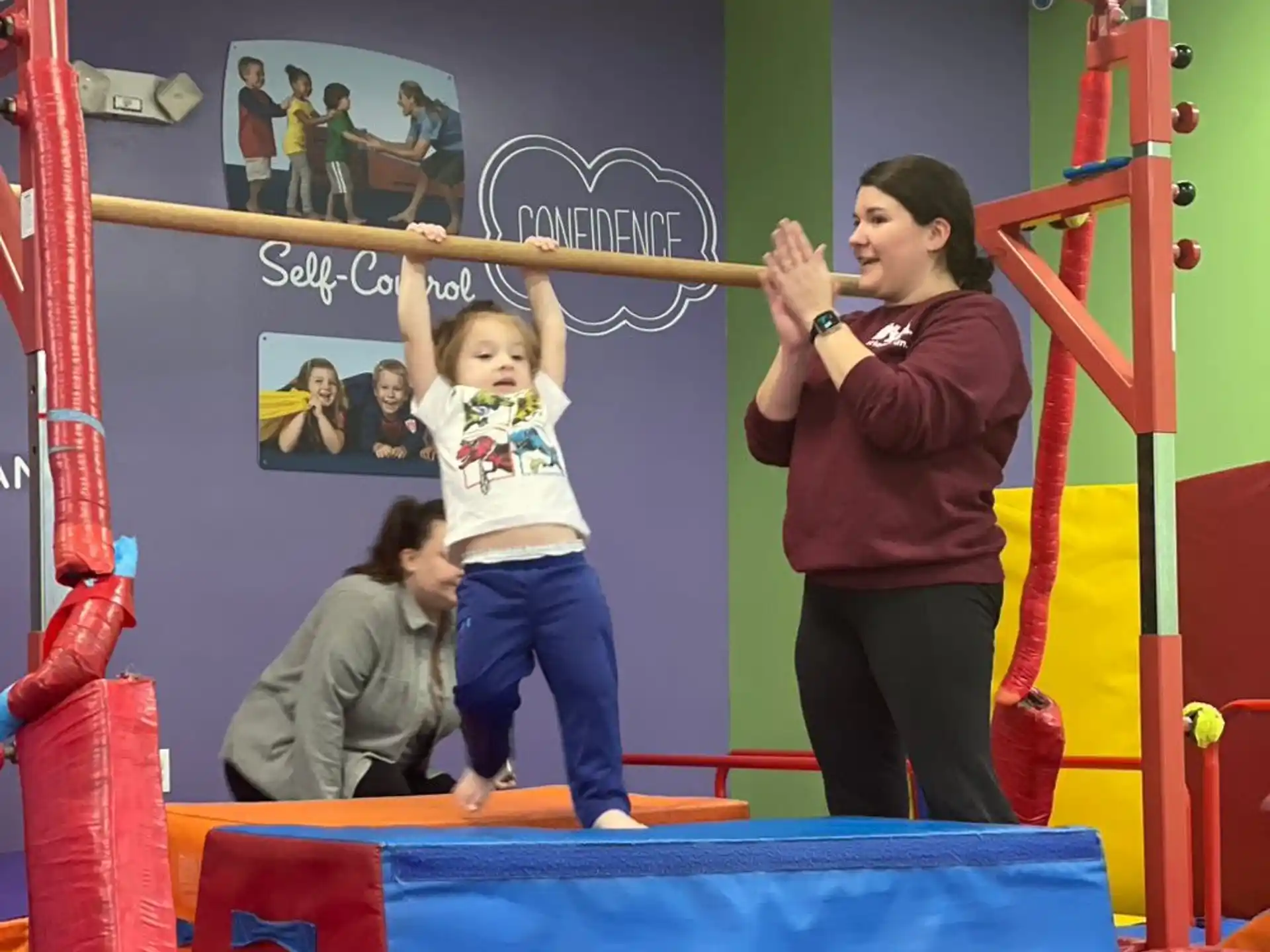 a person and a child playing on a playground