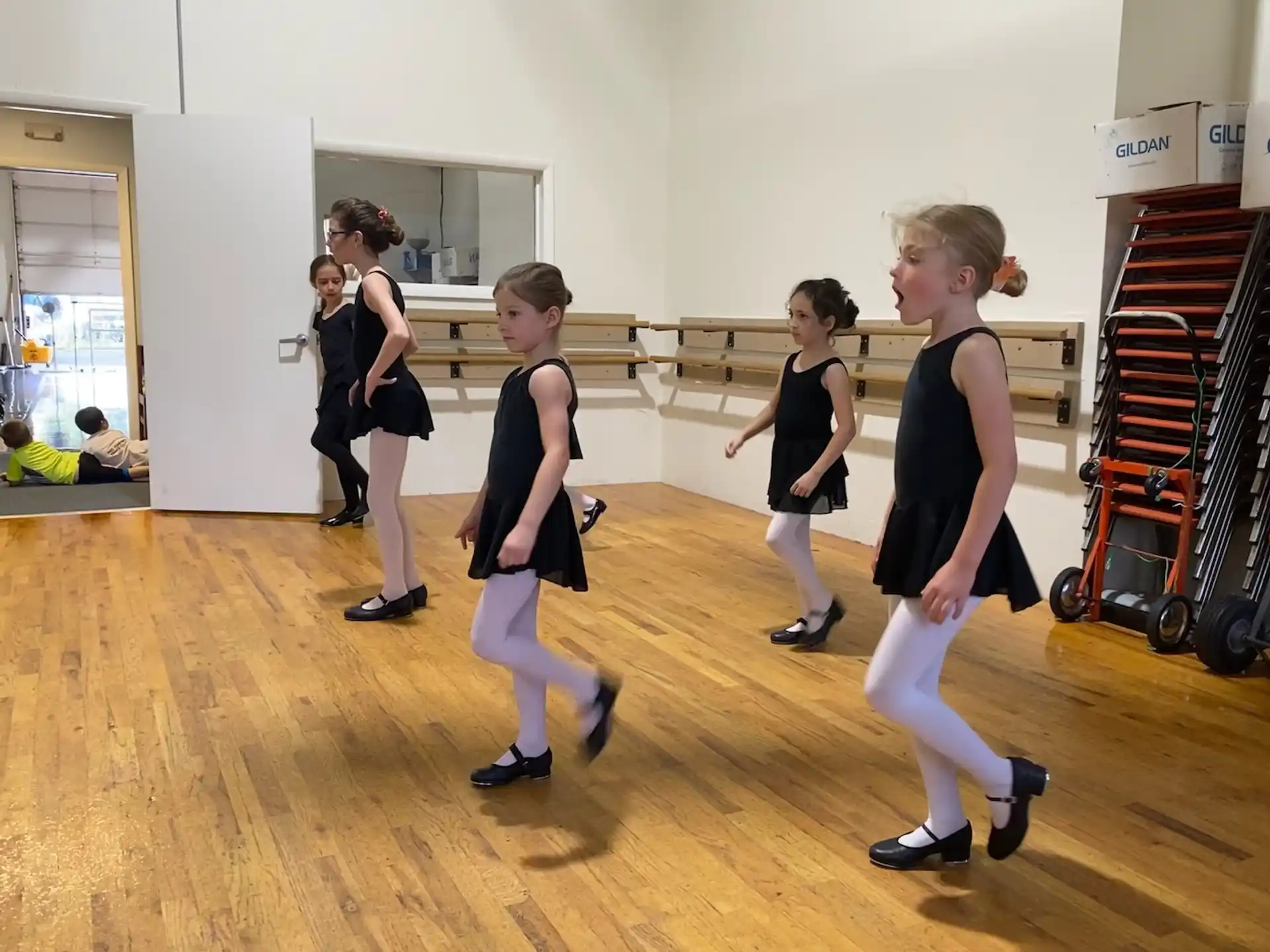 a group of girls dancing in a room