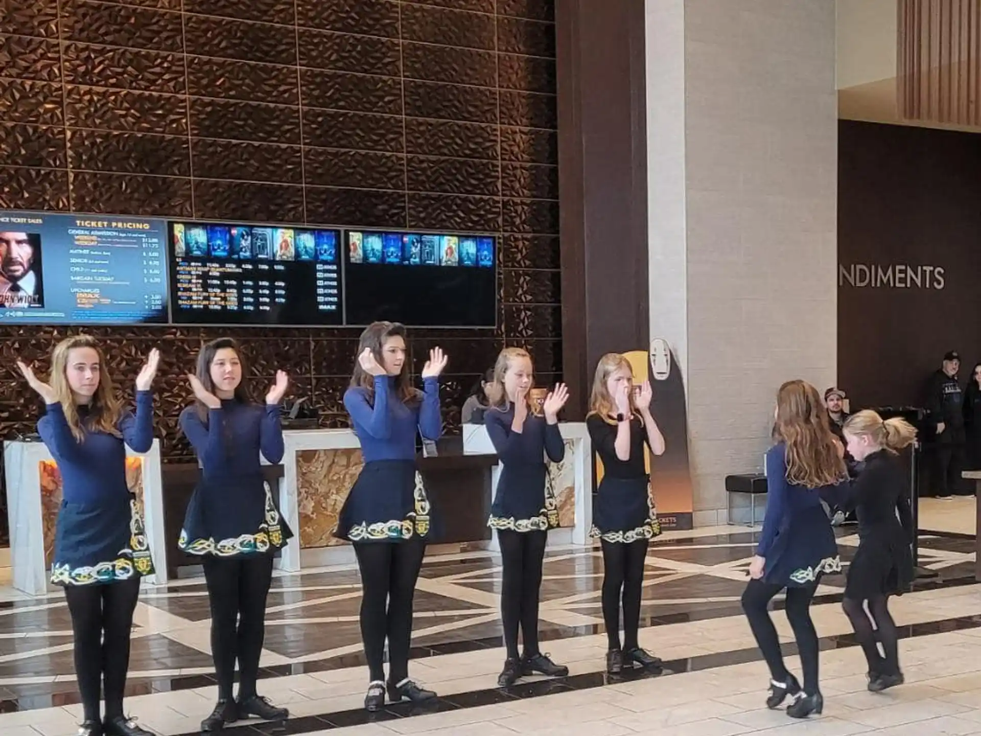 a group of women in blue shirts
