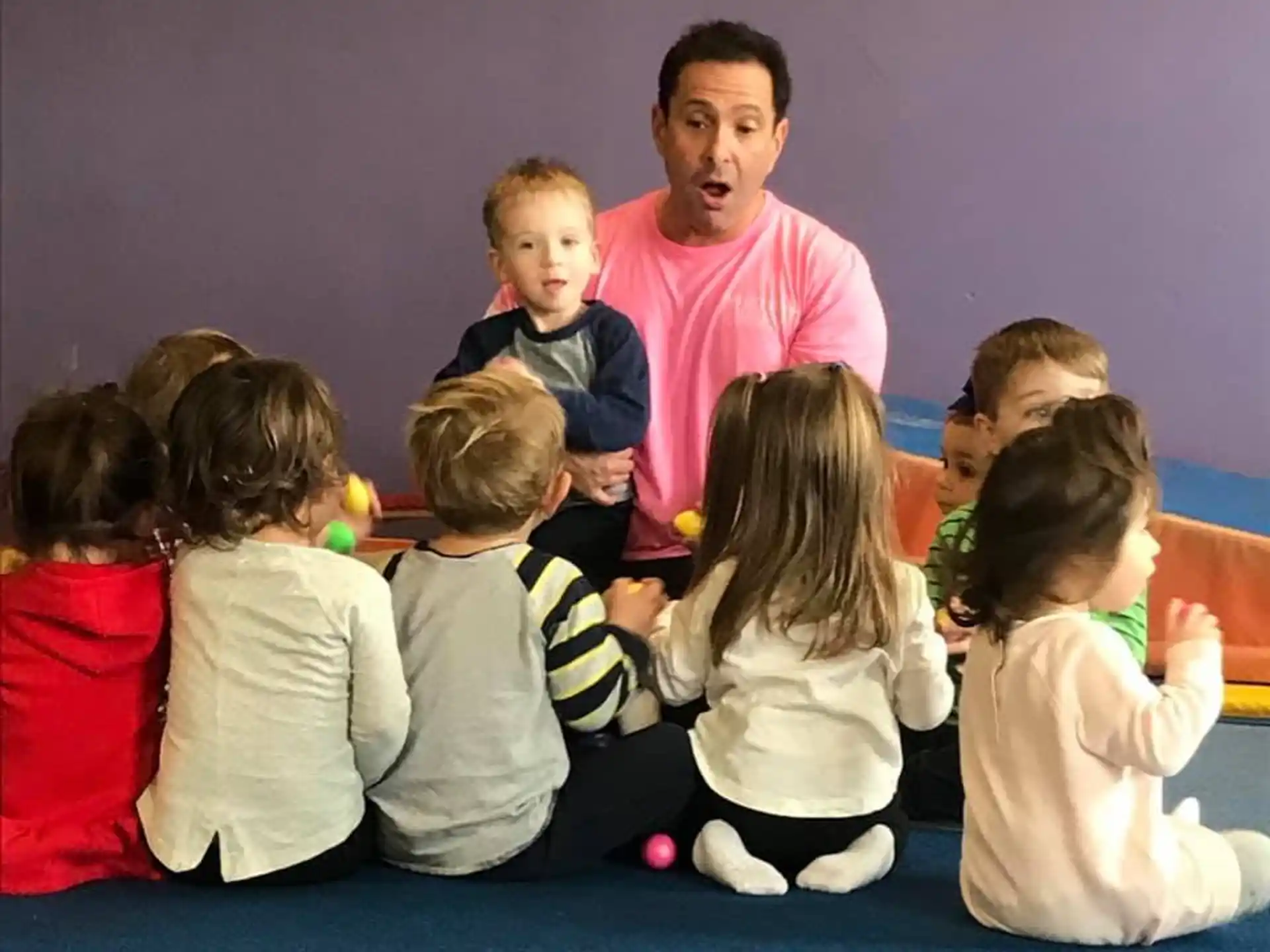 a person and a group of children
