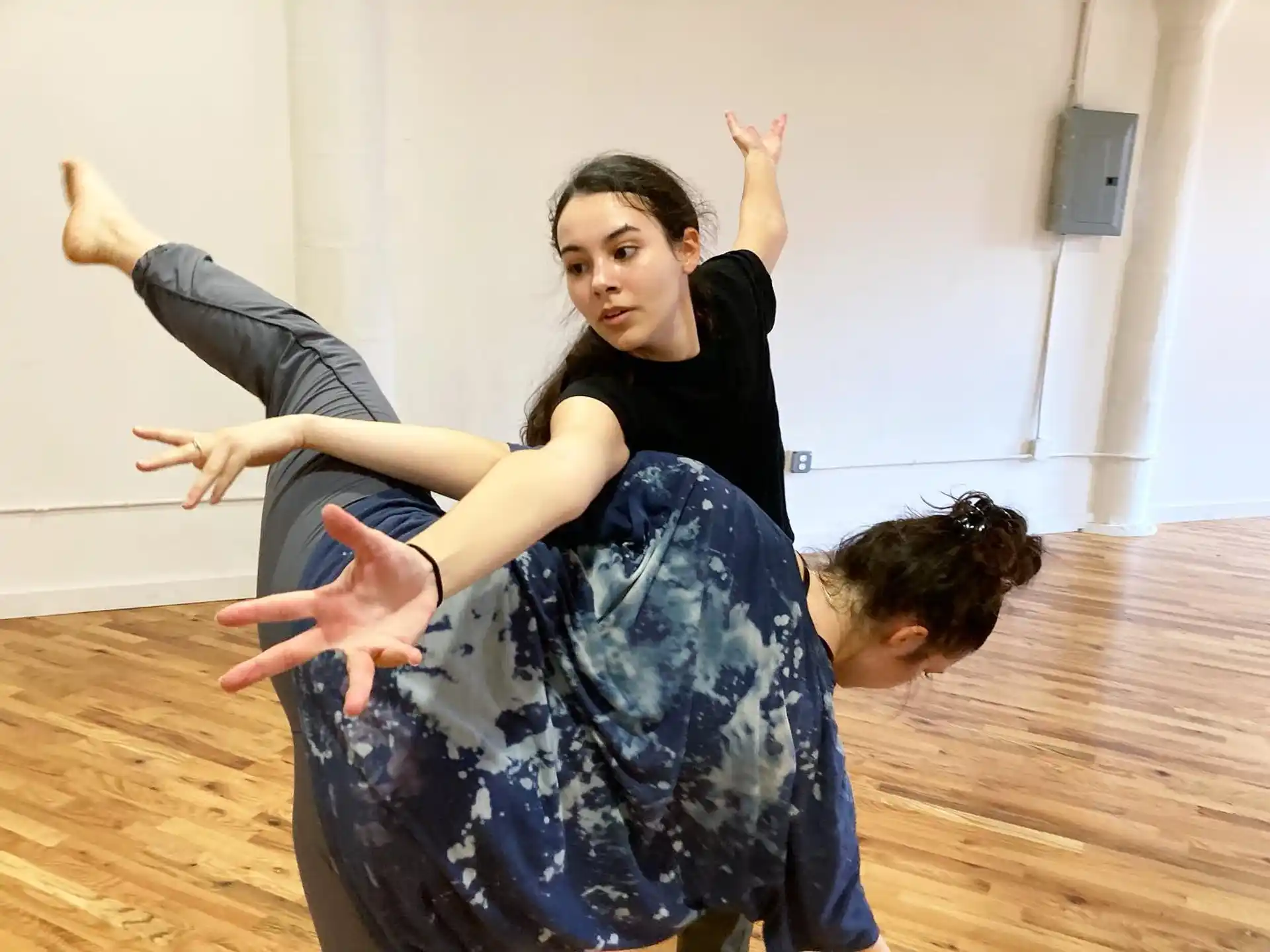 a person holding another woman
