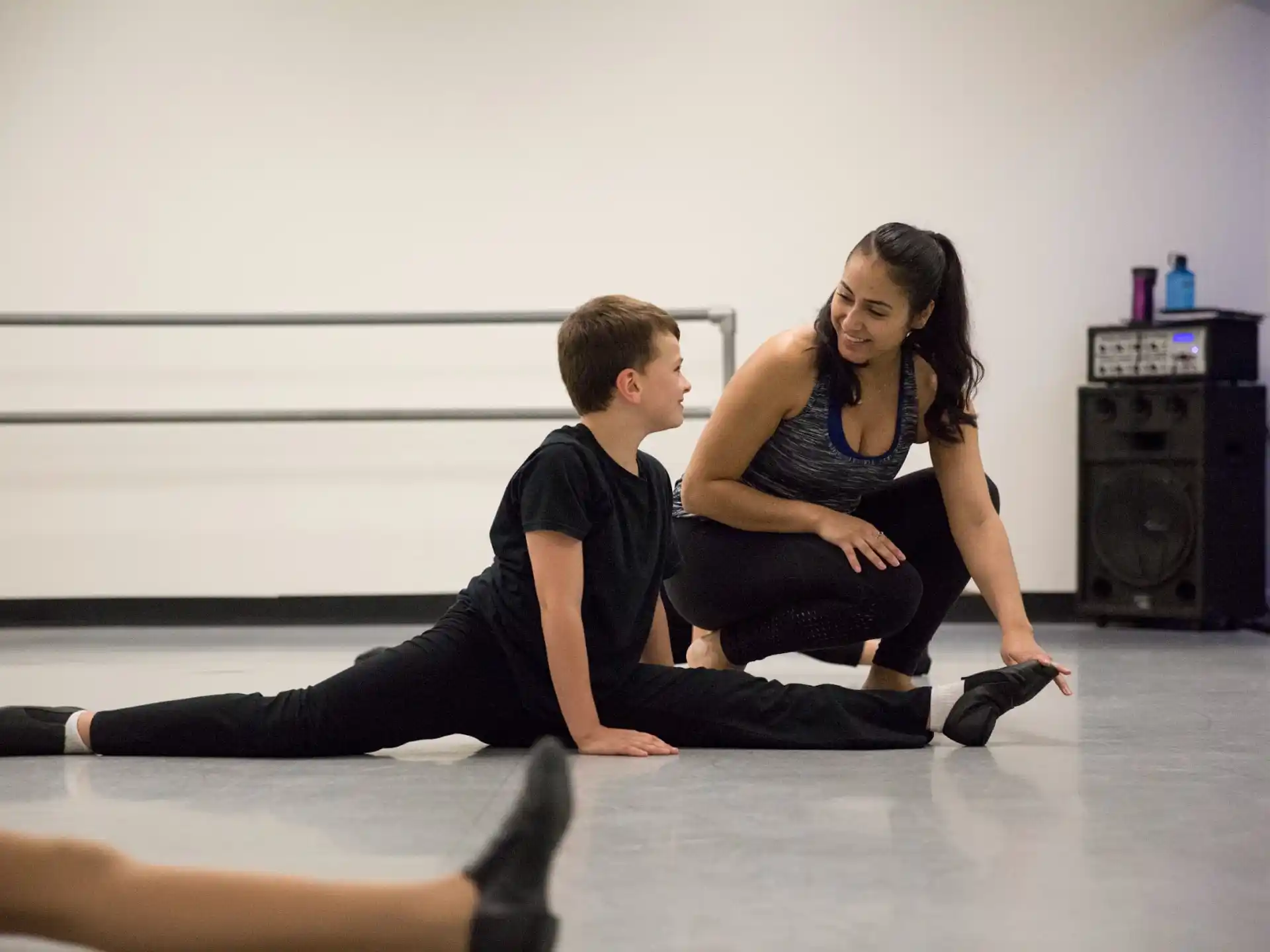 a man and woman sitting on the floor