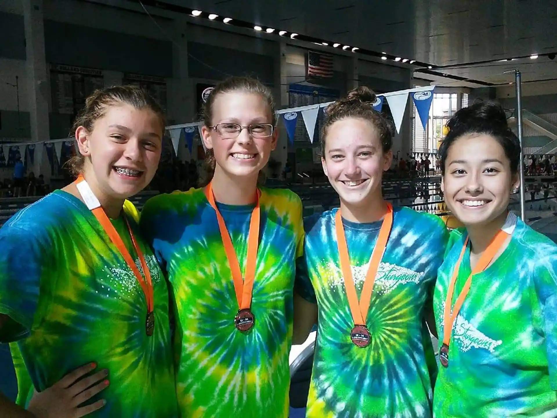 a group of people wearing medals