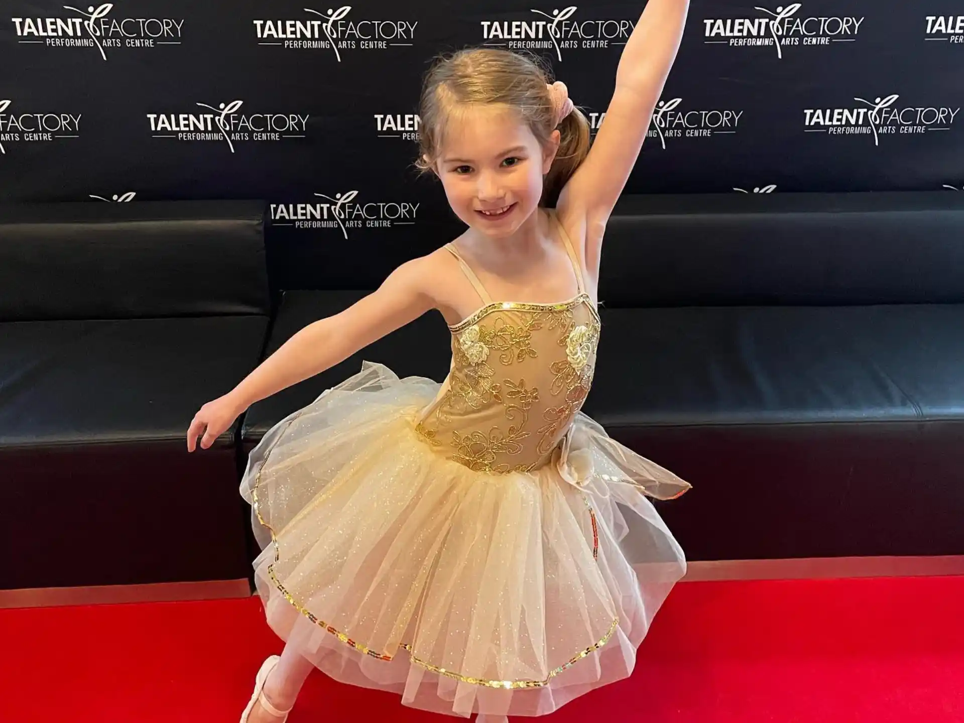 a girl in a dress dancing