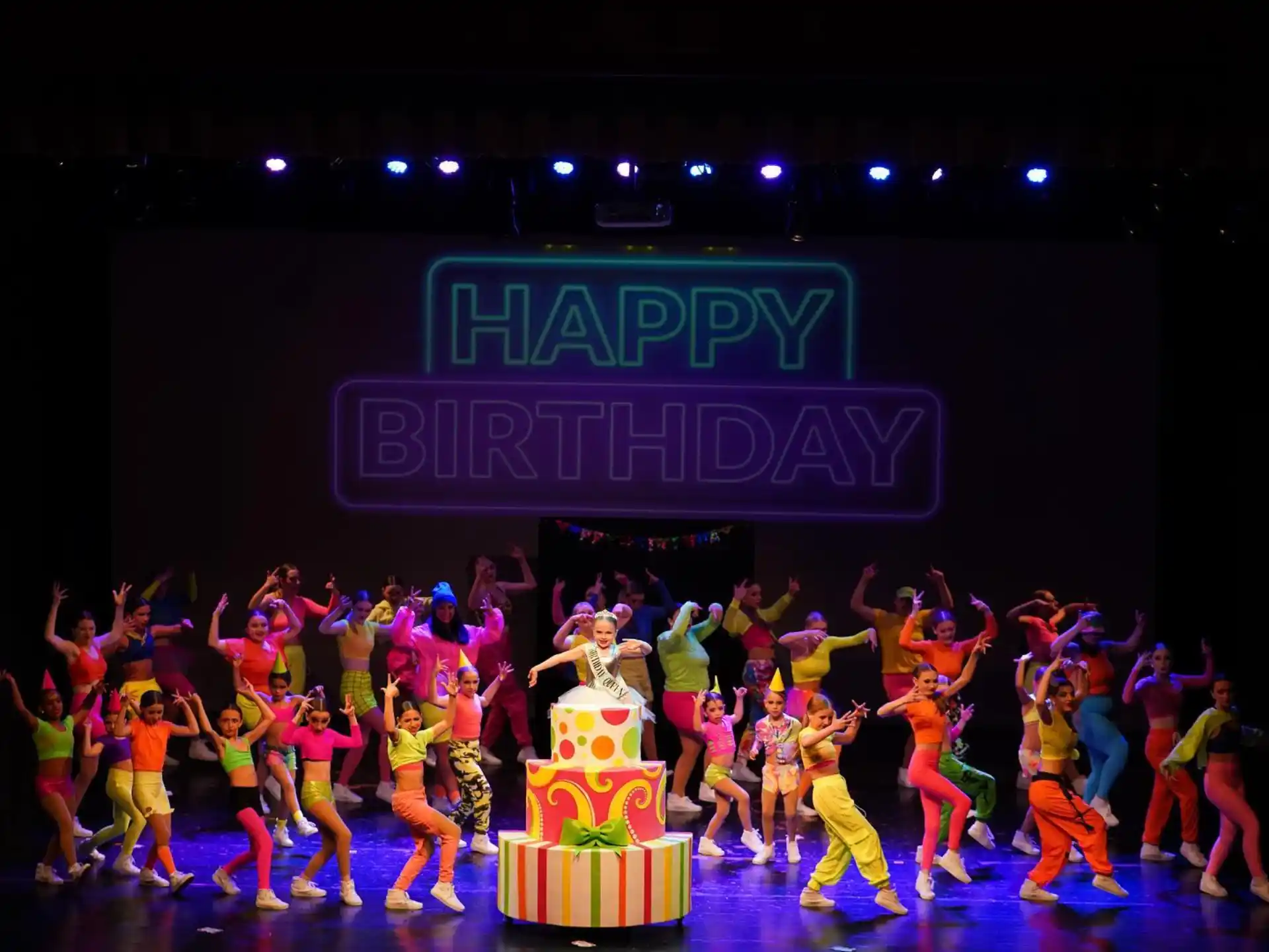 a group of people dancing on a stage