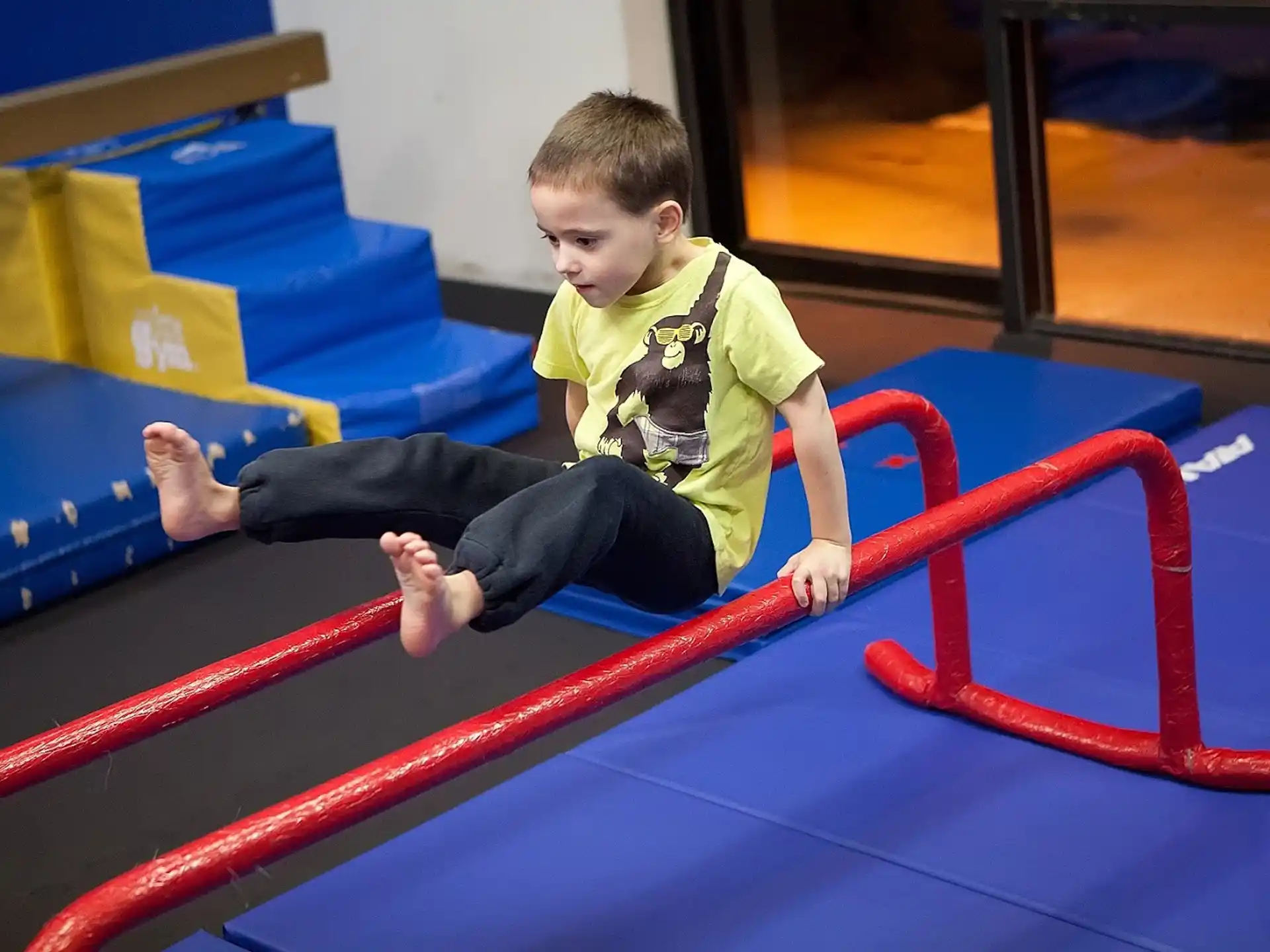 a boy sitting on a trampoline