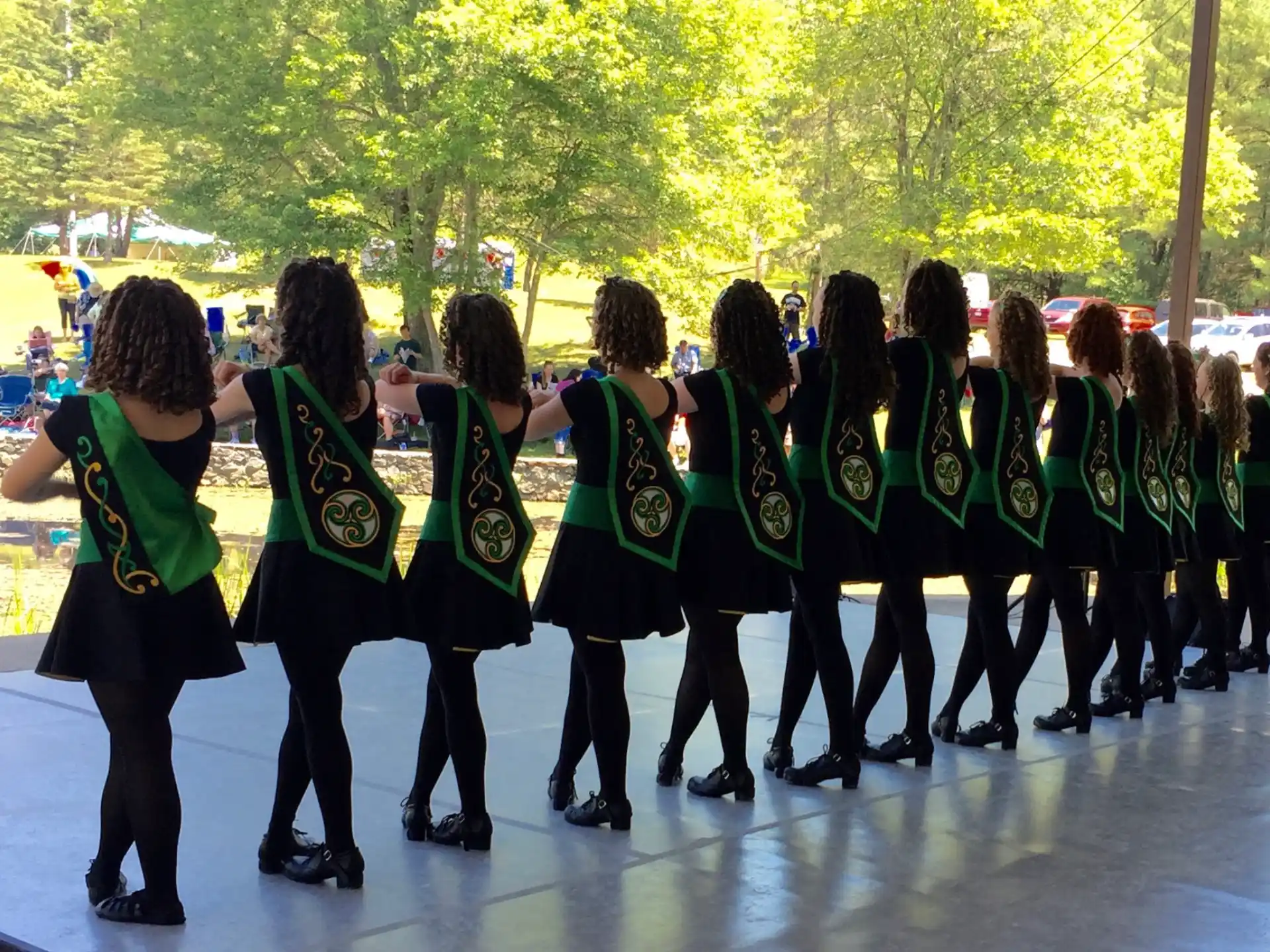 a group of people in green uniforms