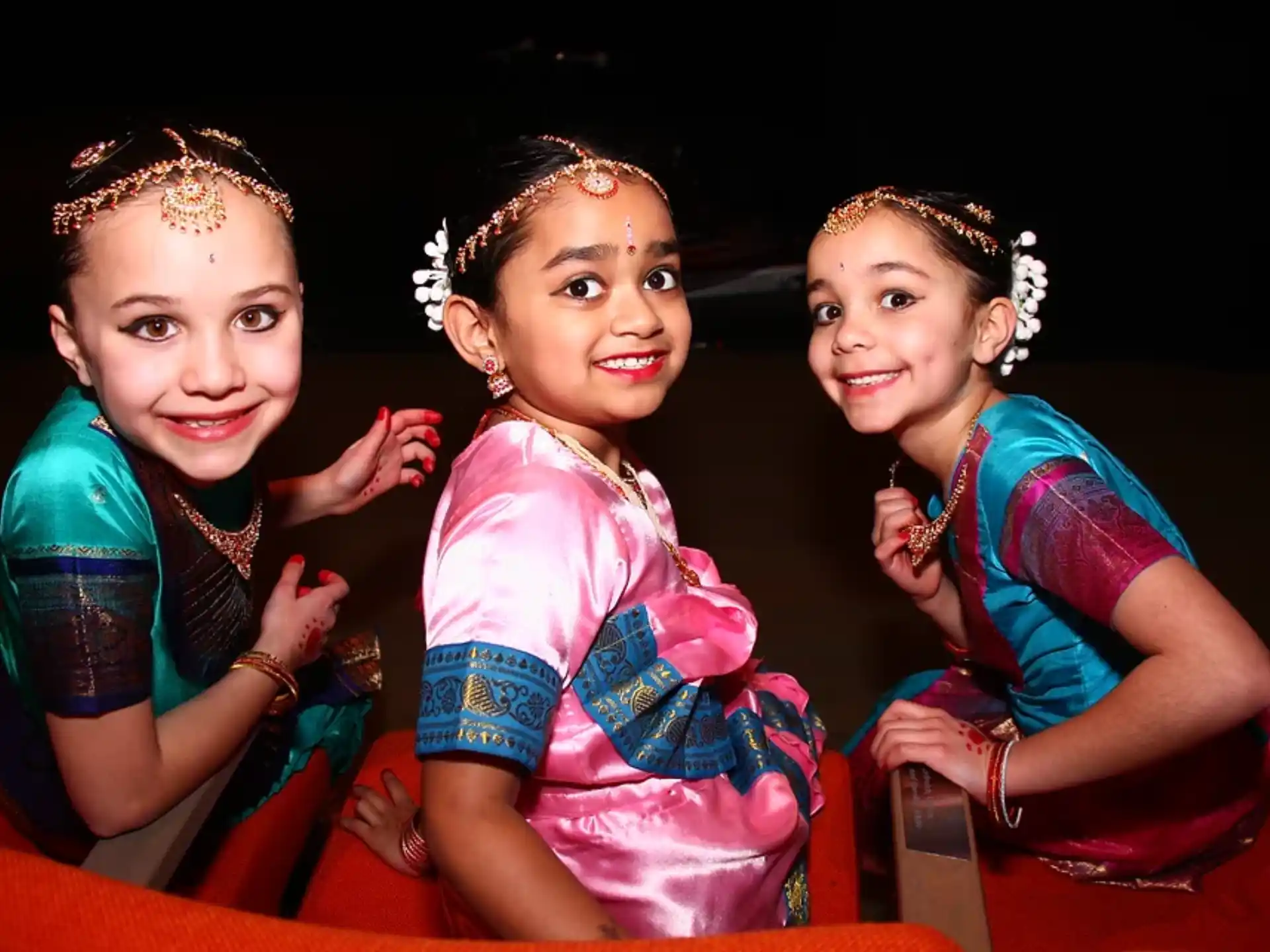 a group of girls posing for a photo