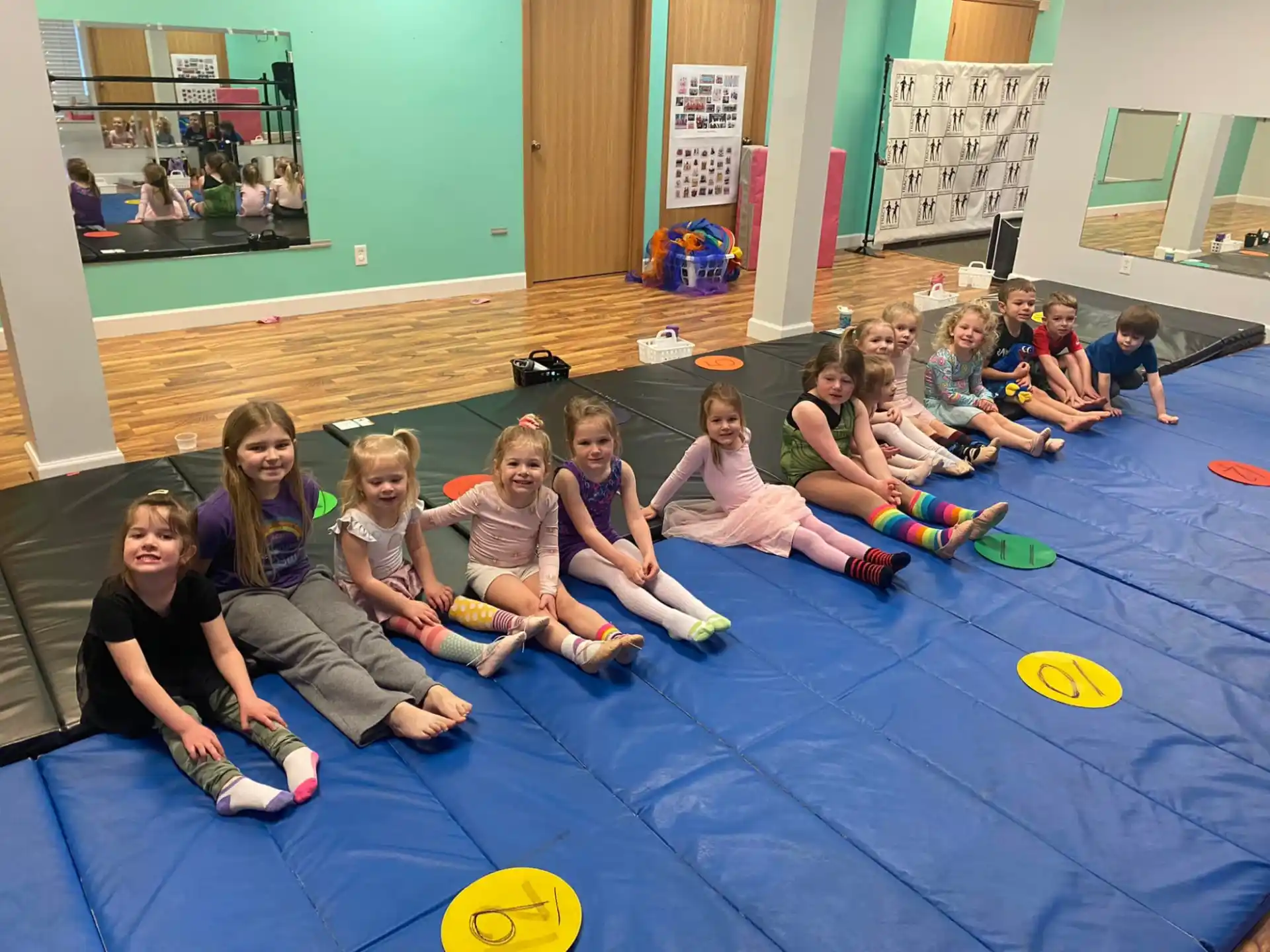a group of children sitting on the floor