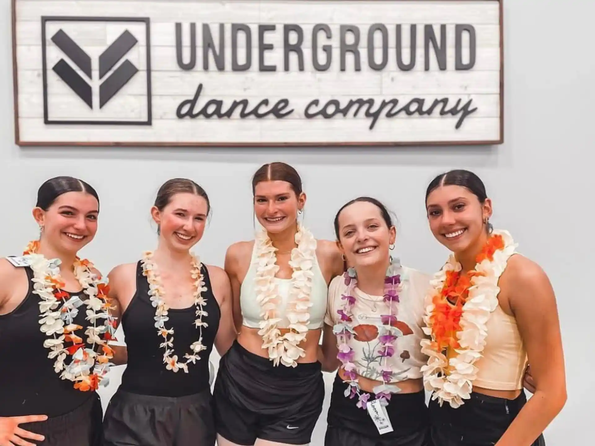a group of women posing for a photo