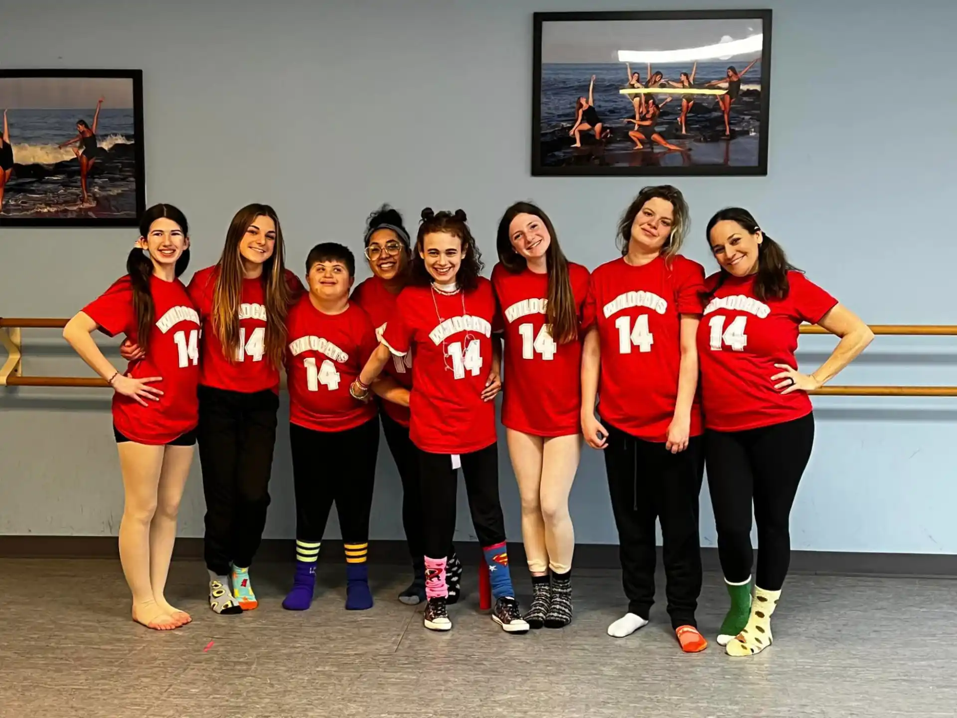 a group of women in red shirts