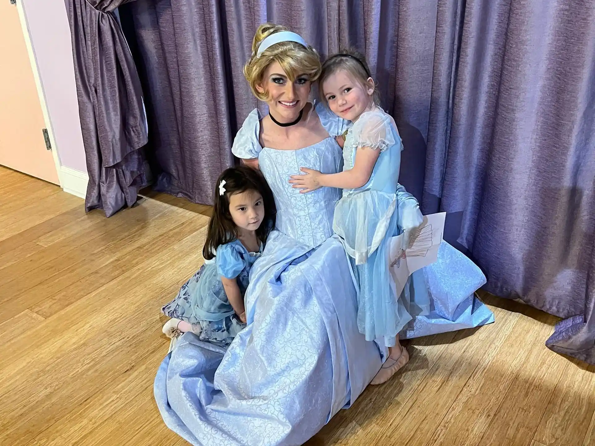 a group of girls in dresses