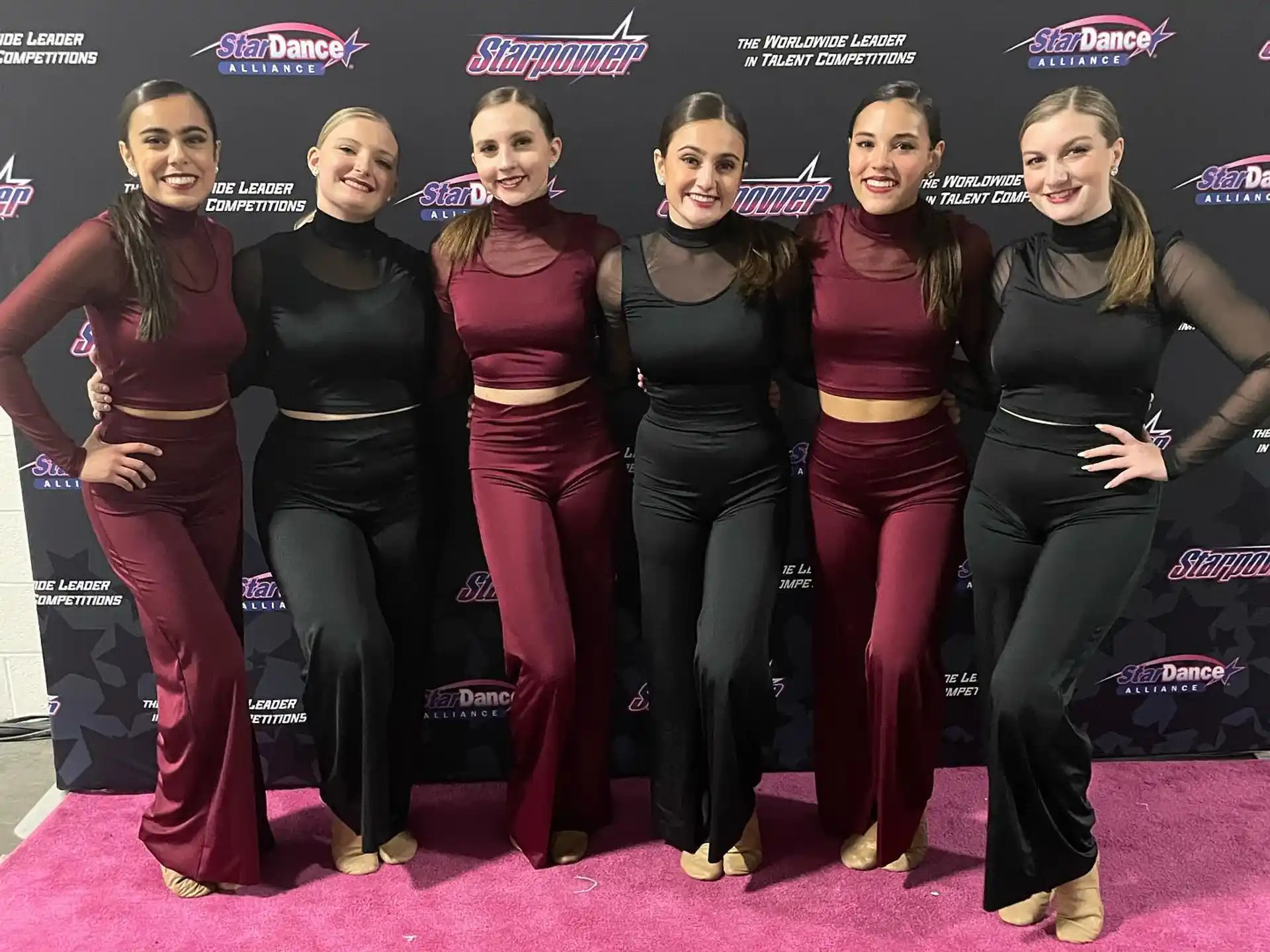 a group of women posing for a photo