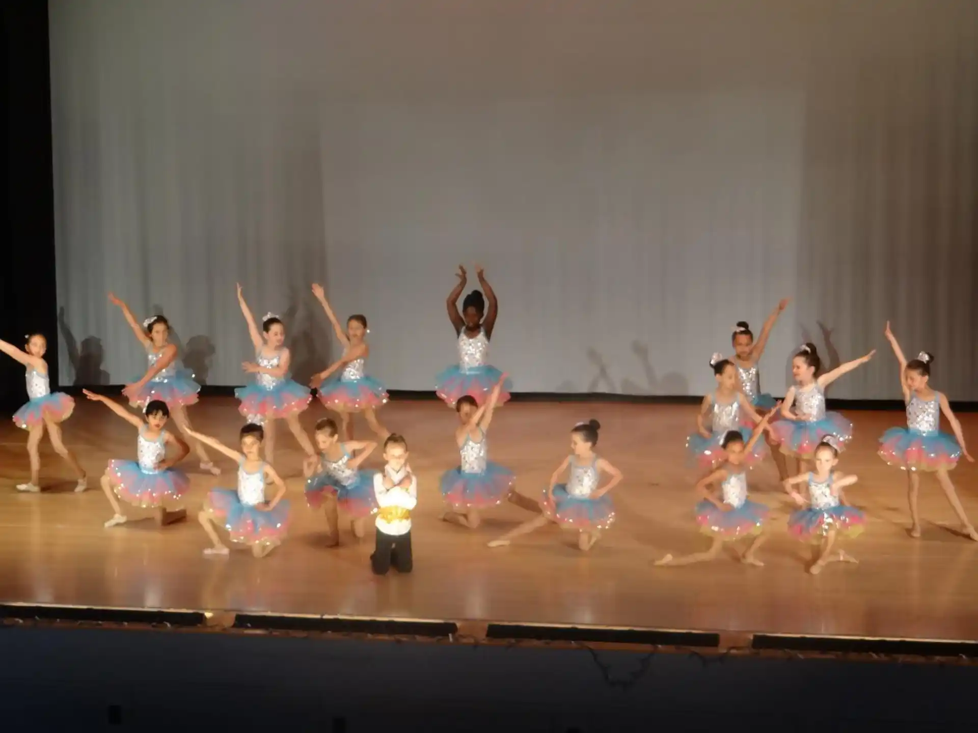 a group of people performing on a stage