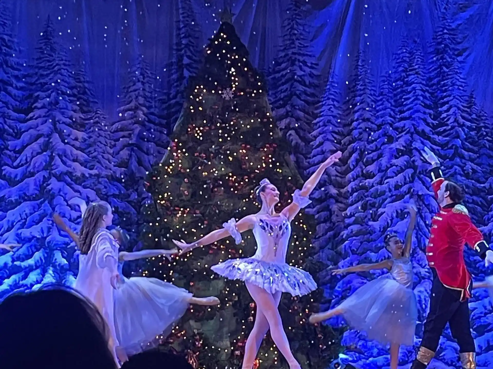 a group of people dancing on a stage