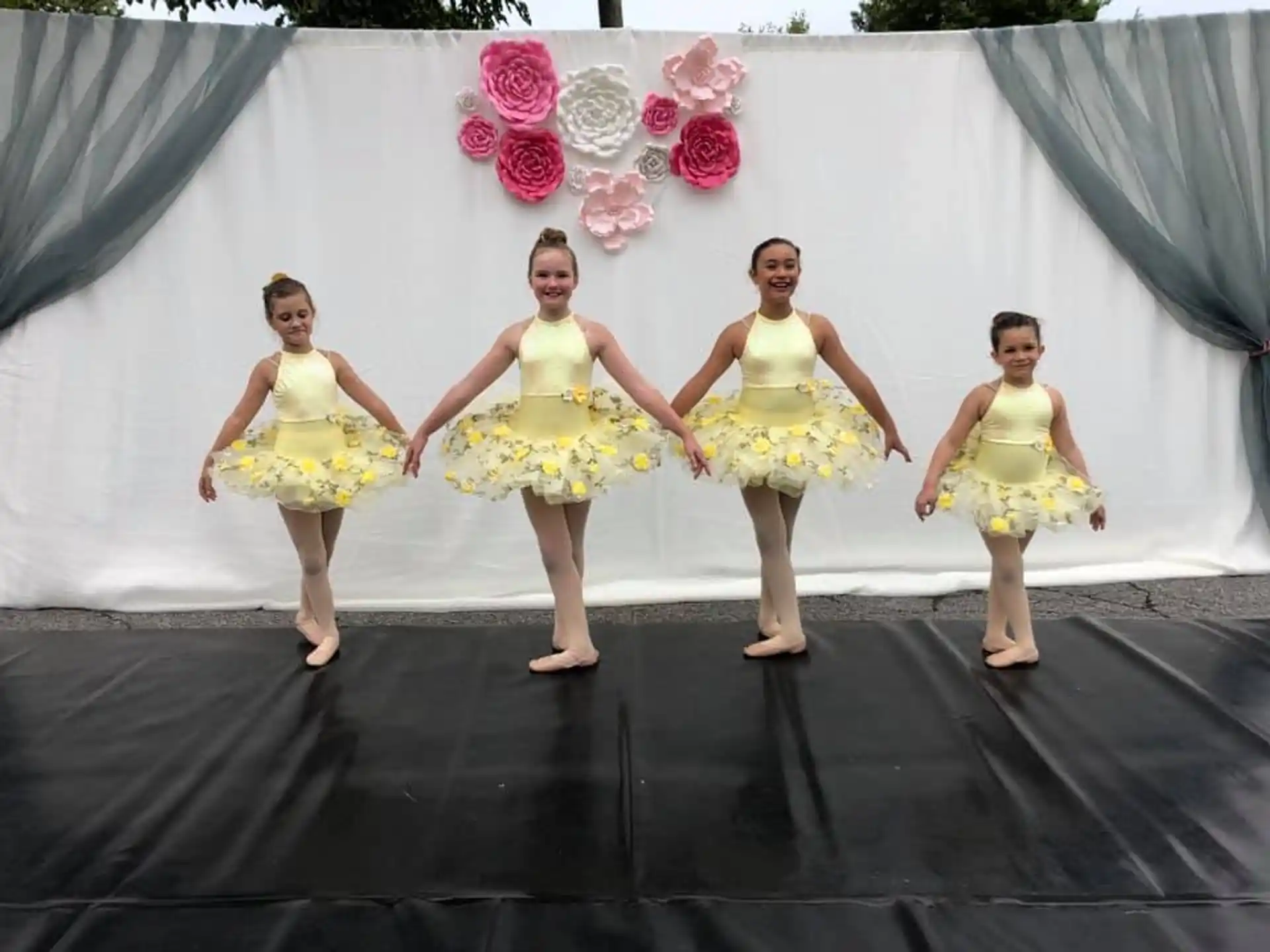 a group of women in yellow dresses